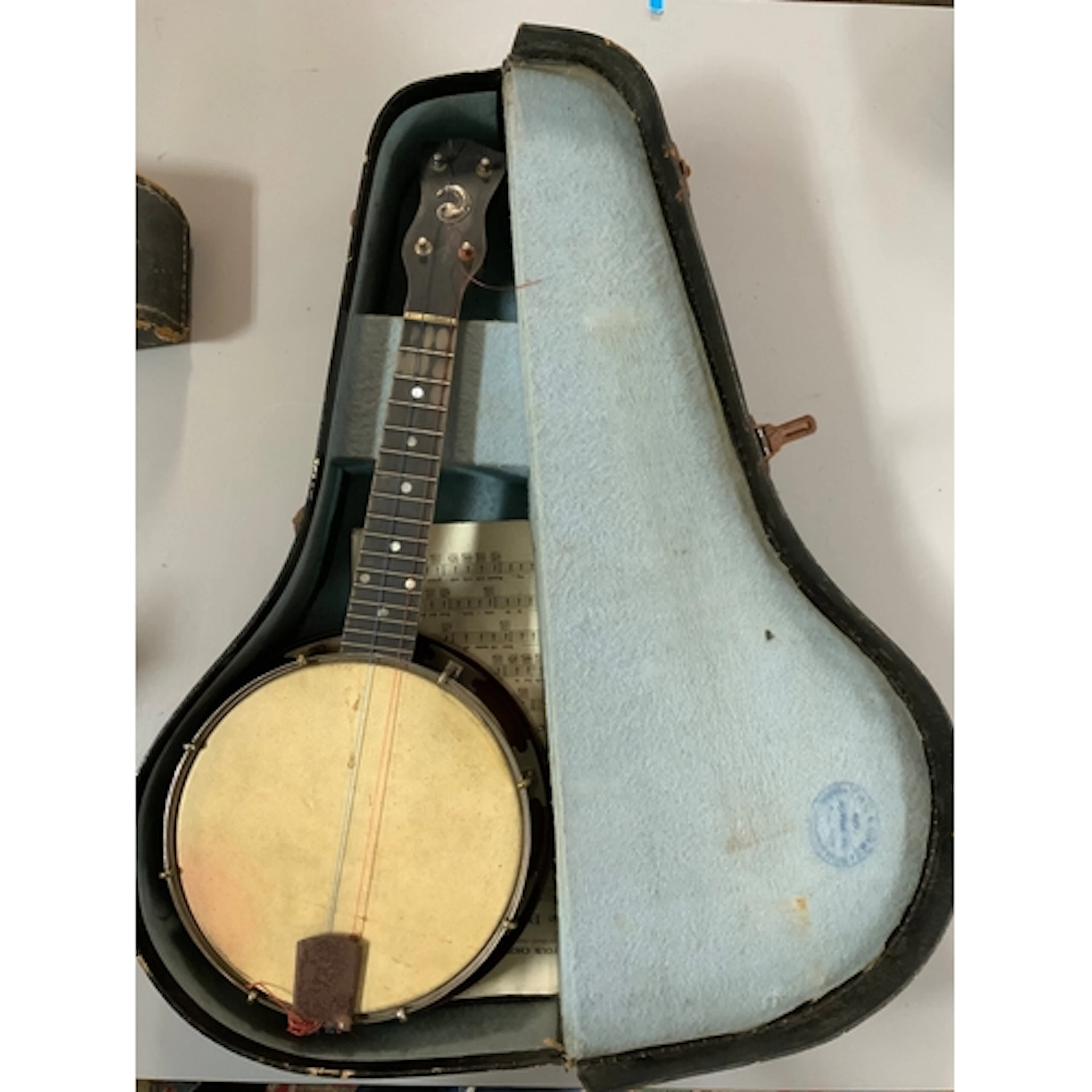 A vintage cased Whirlie banjo.- NO RESERVE