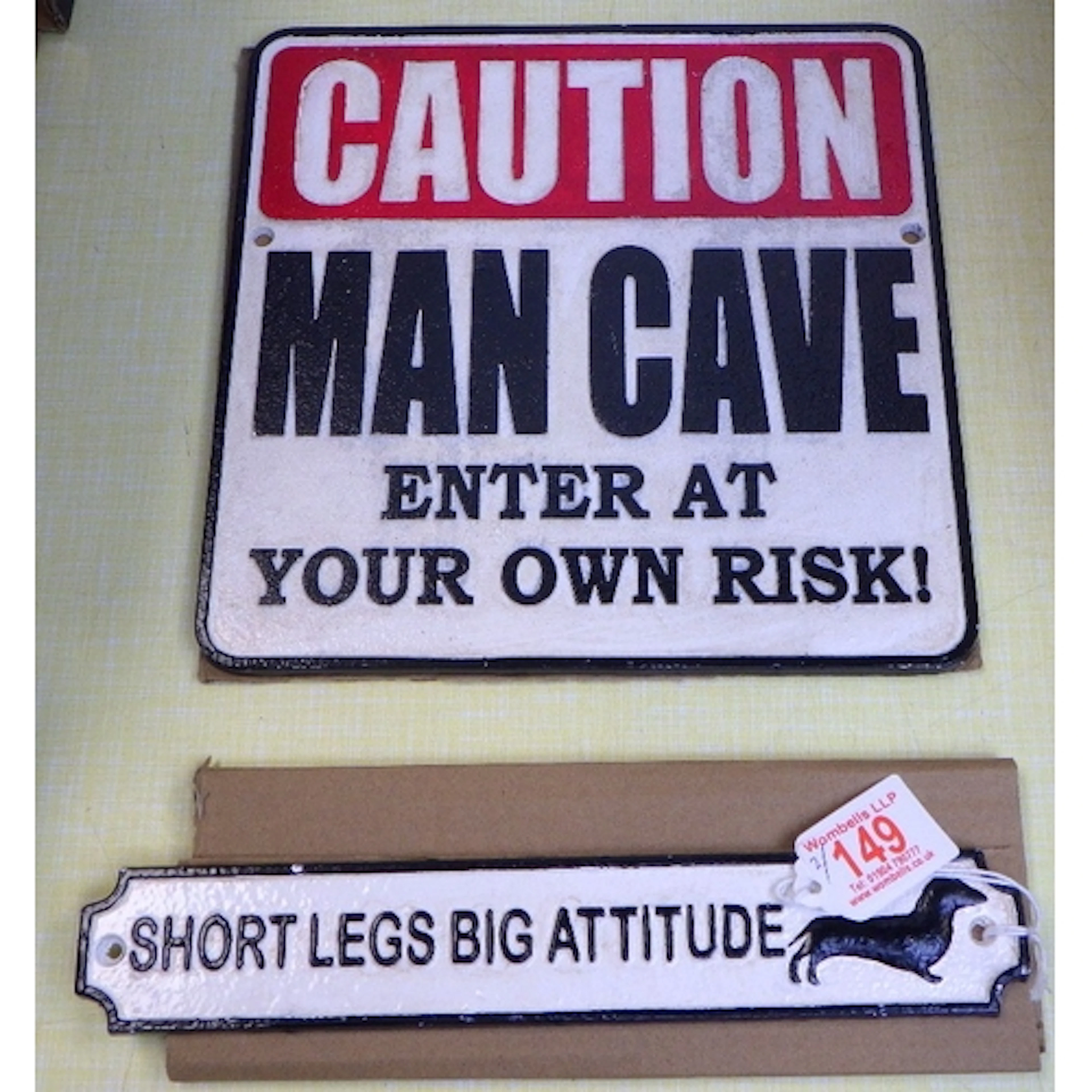 Two cast signs (2)