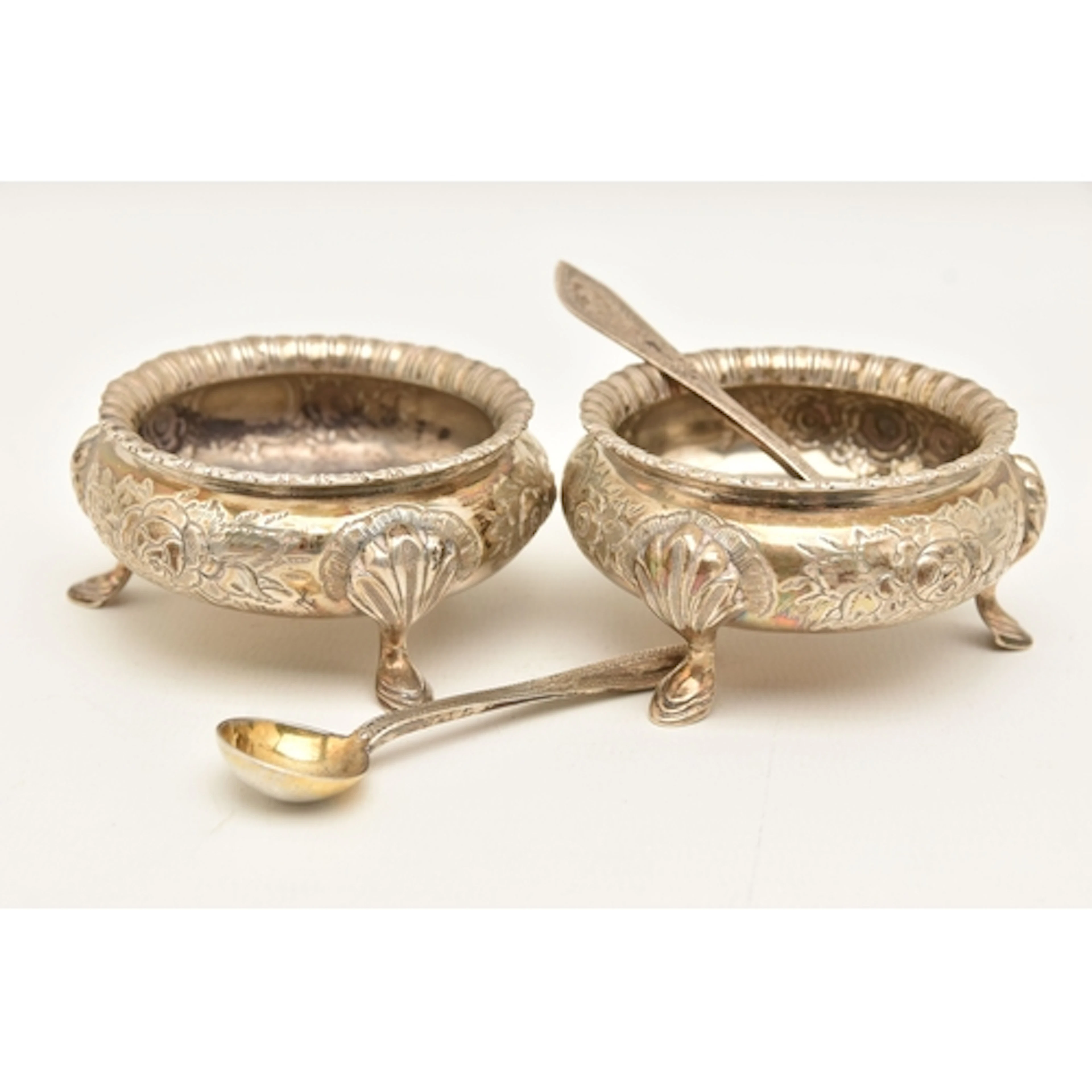 A PAIR OF VICTORIAN SILVER SALTS WITH SPOONS, cauldron shape...