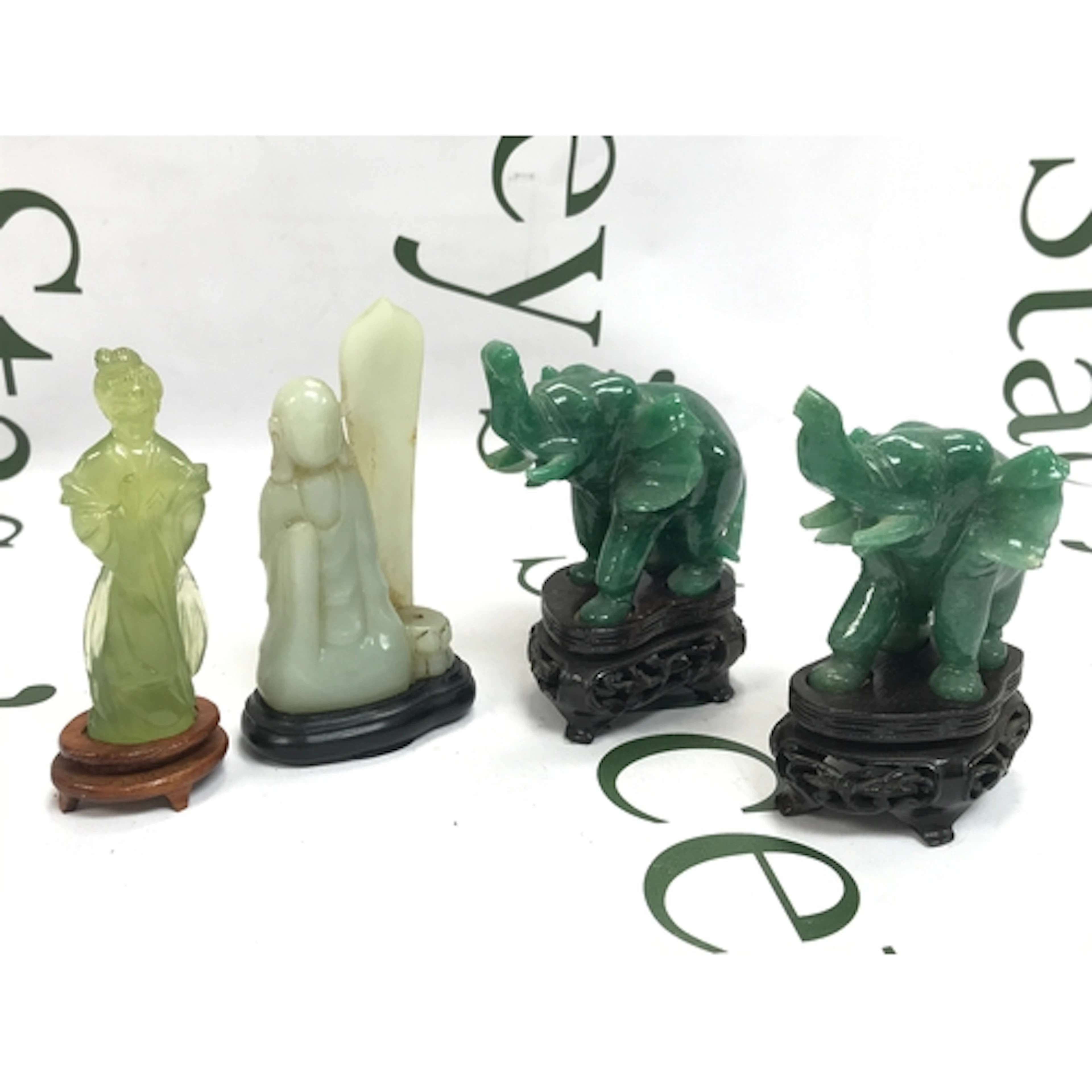 Carved green and white hardstone or jade-style Asian figurin...