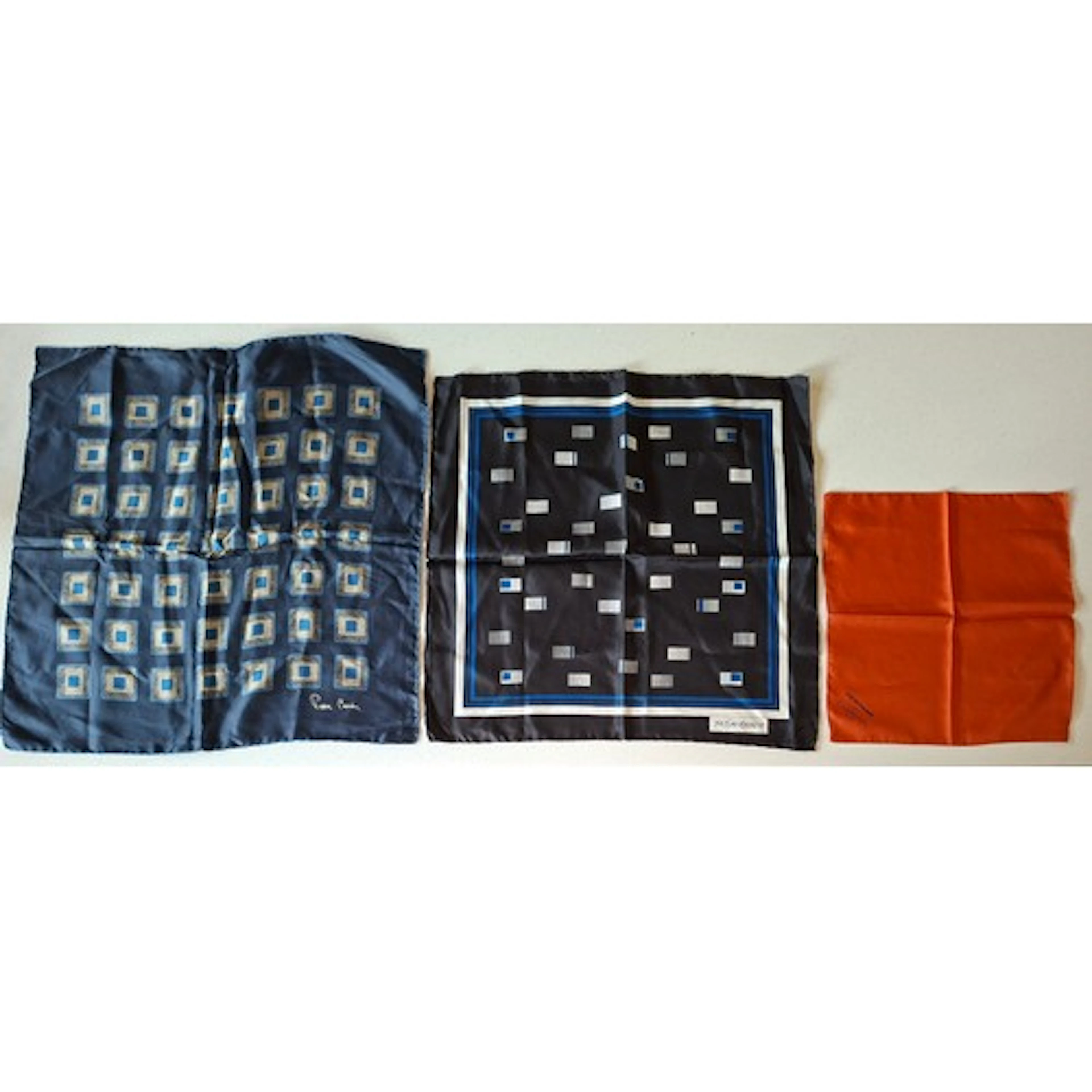 YSL- A navy silk neckerchief having a geometric pattern, tog...