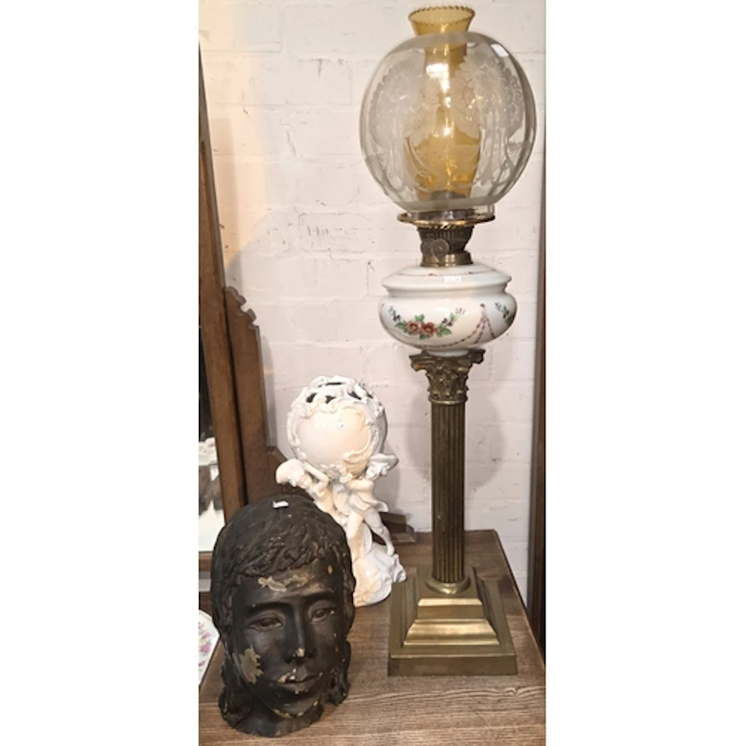 A brass Corinthian column oil lamp duplex with painted reser...