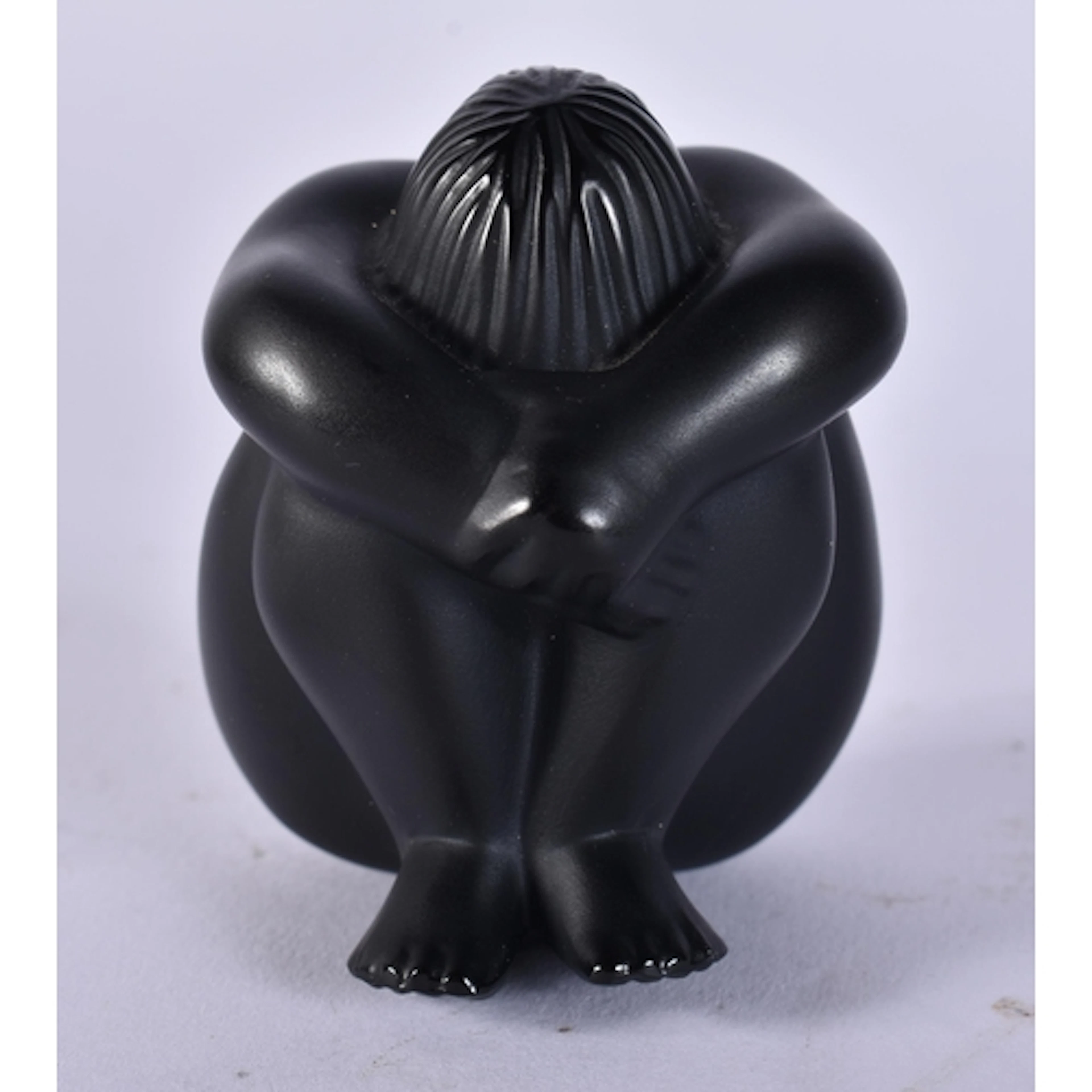 A LALIQUE BLACK GLASS FIGURE OF A NUDE. 220 grams. 6 cm x 5....