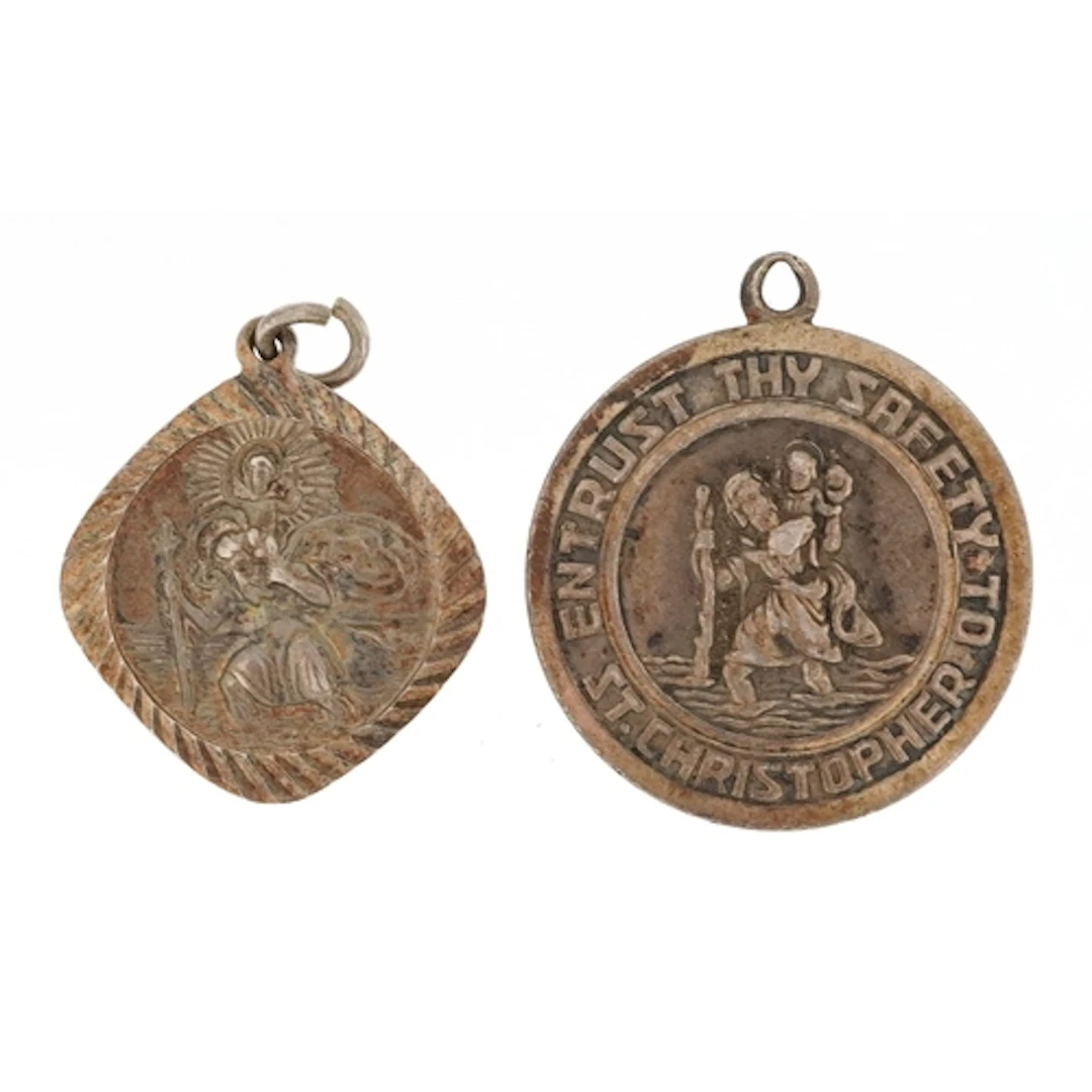 Georg Jensen, two silver St. Christopher pendants, the large...