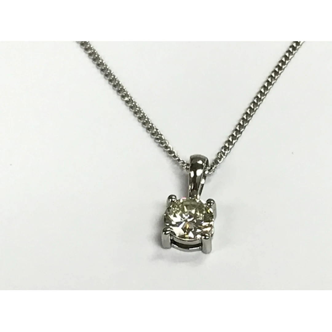 Platinum four claw set brilliant cut diamond solitaire penda...