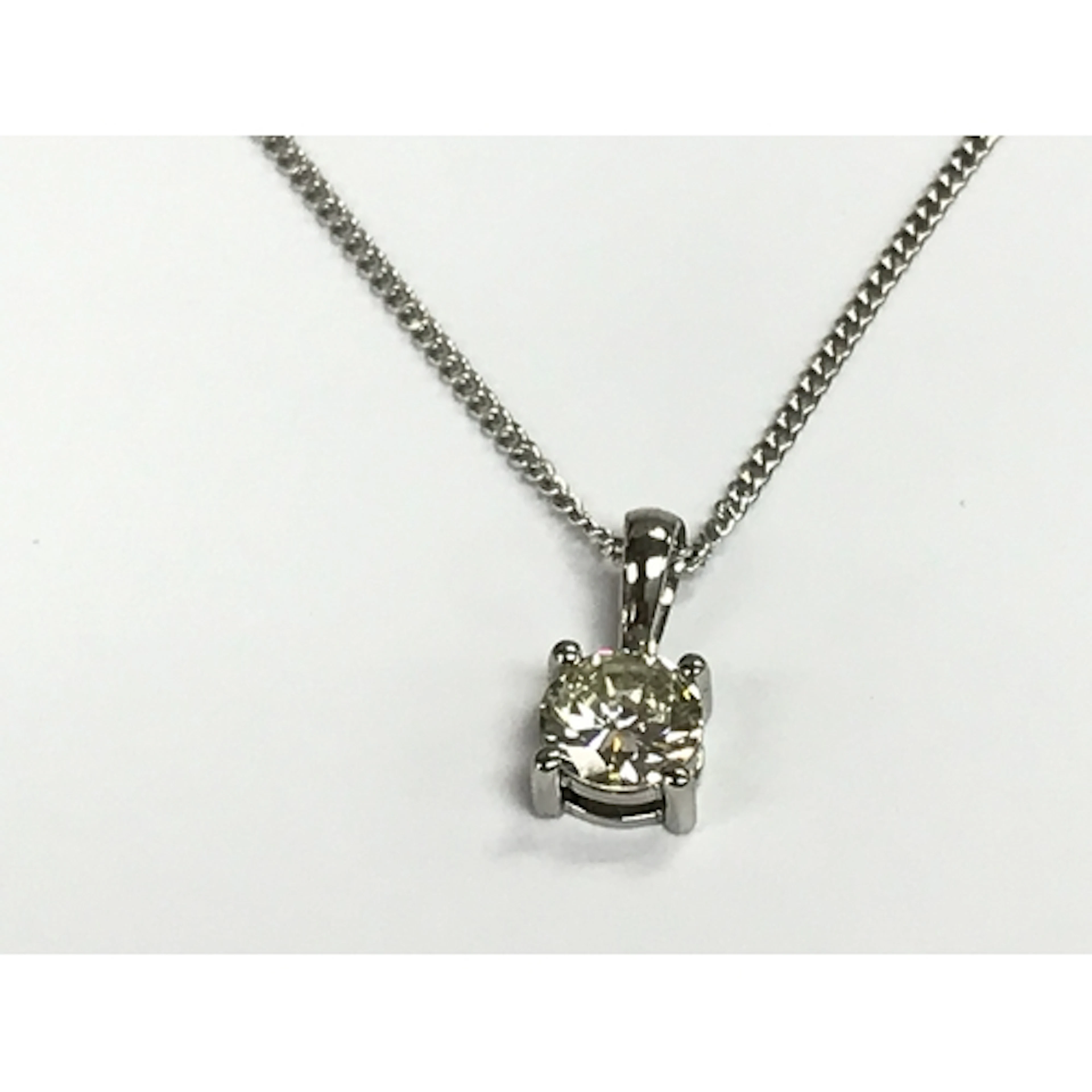 Platinum four claw set brilliant cut diamond solitaire penda...