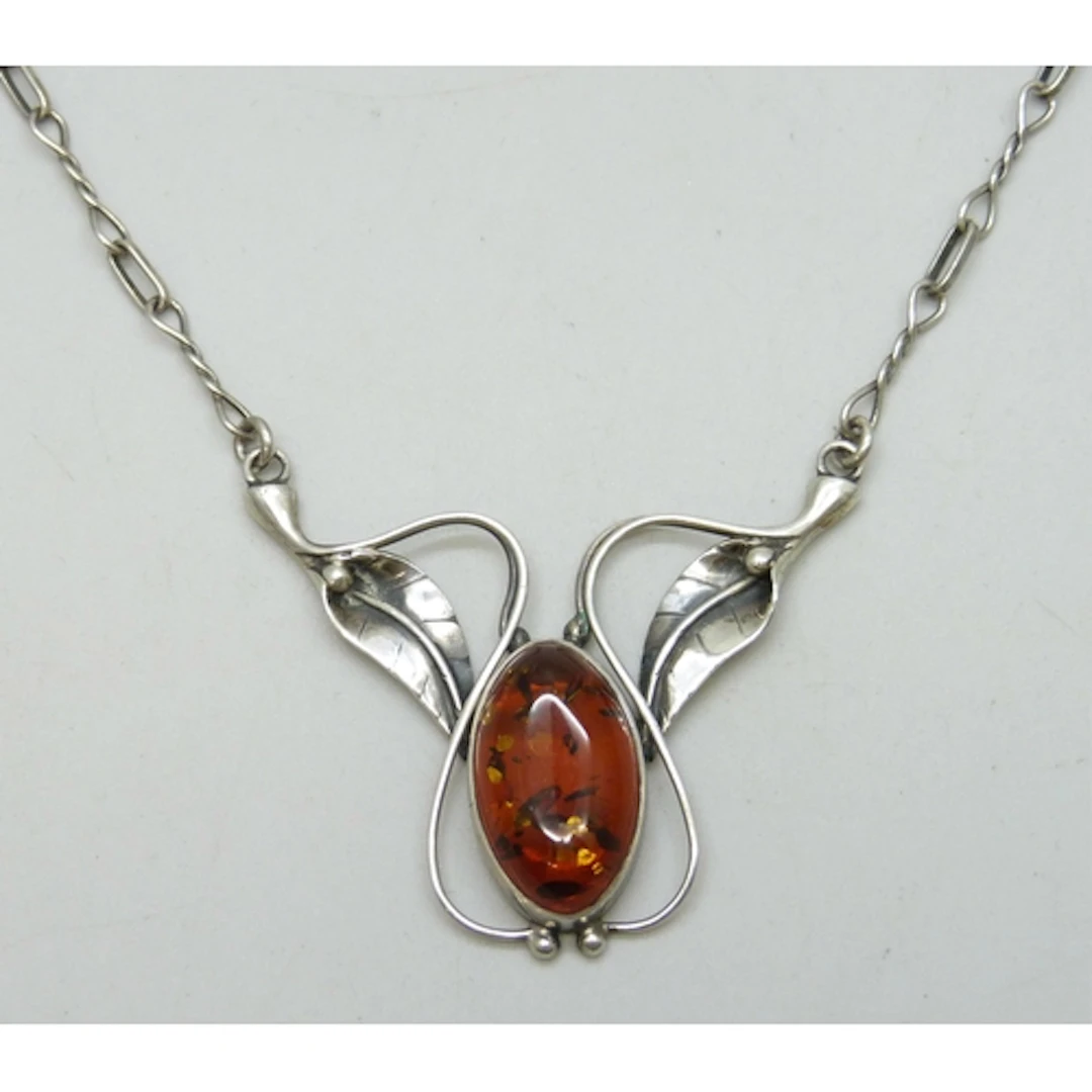 A silver and faux amber Art Nouveau design necklace, 10g, 4....