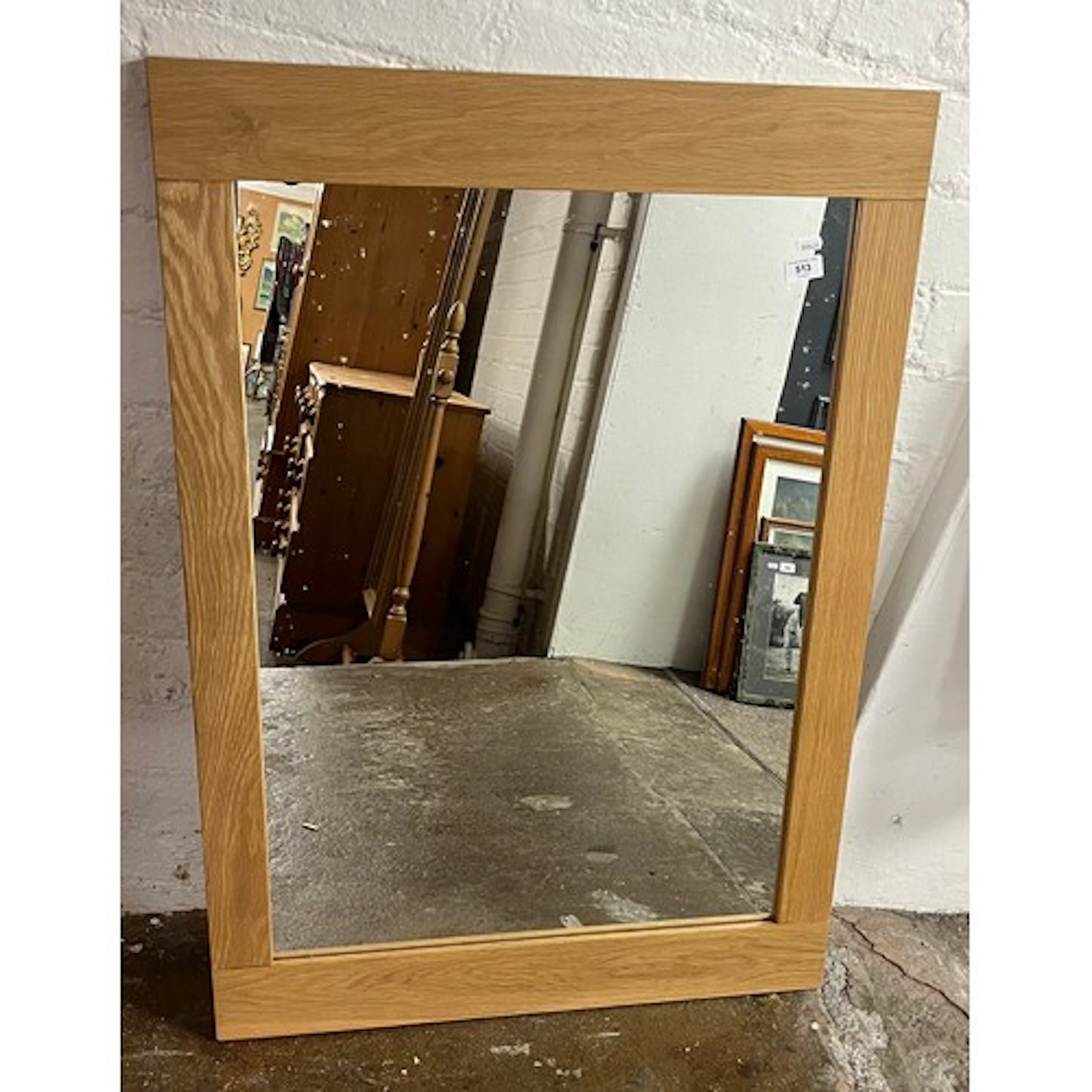 Oak framed rectangular wall mirror.