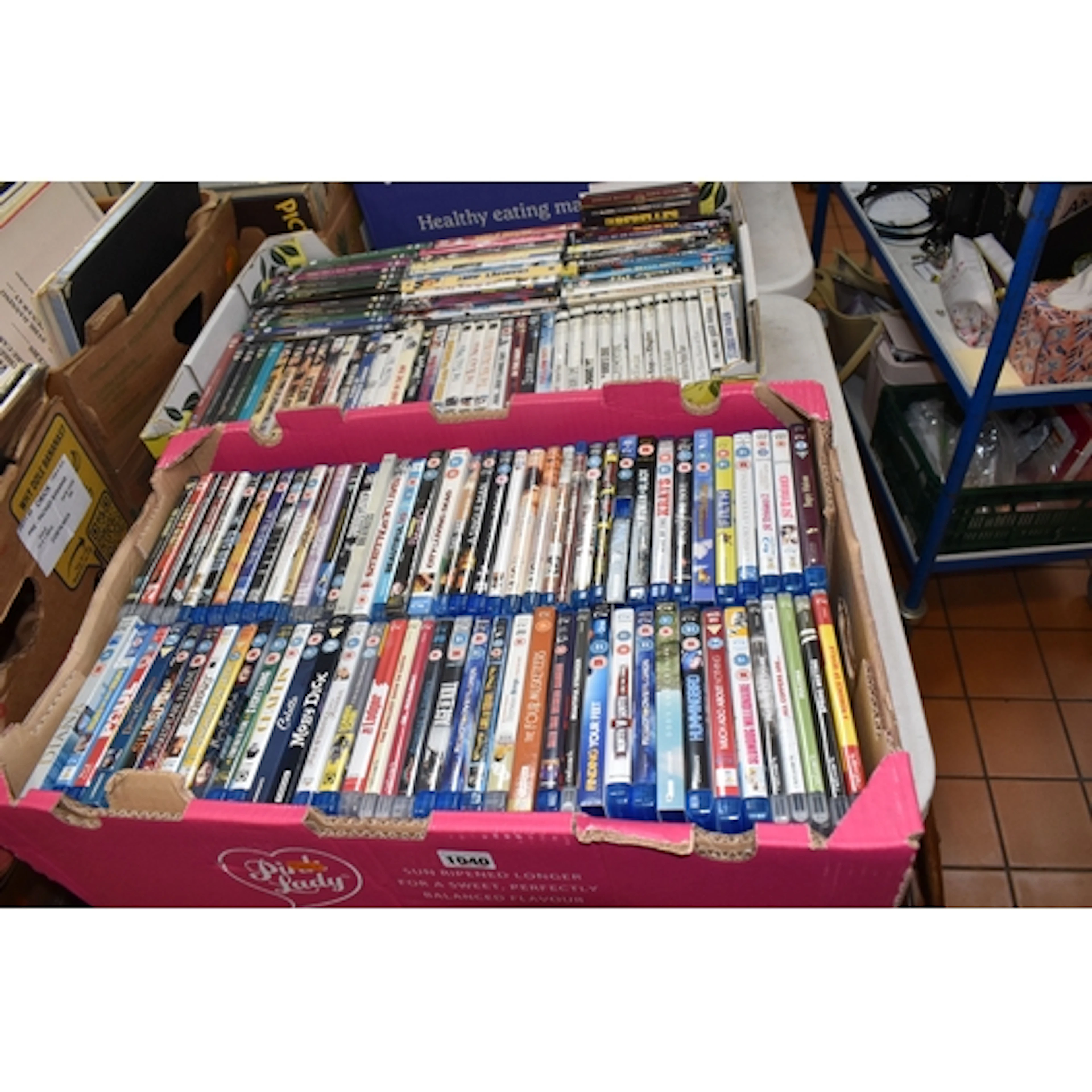 TWO BOXES OF DVDS & BLU-RAY containing 151 miscellaneous fil...