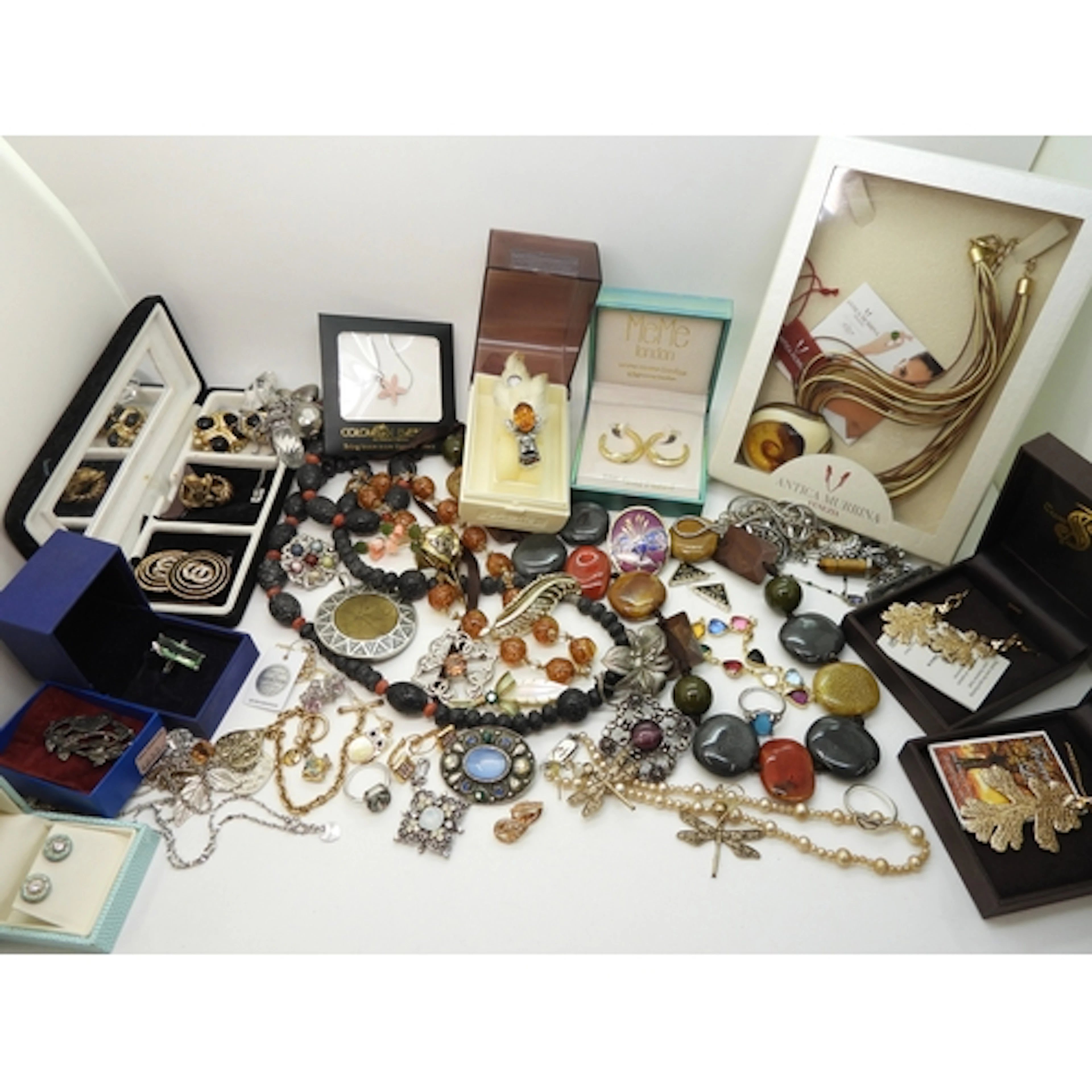 A large collection of costume jewellery to include, a grouse...