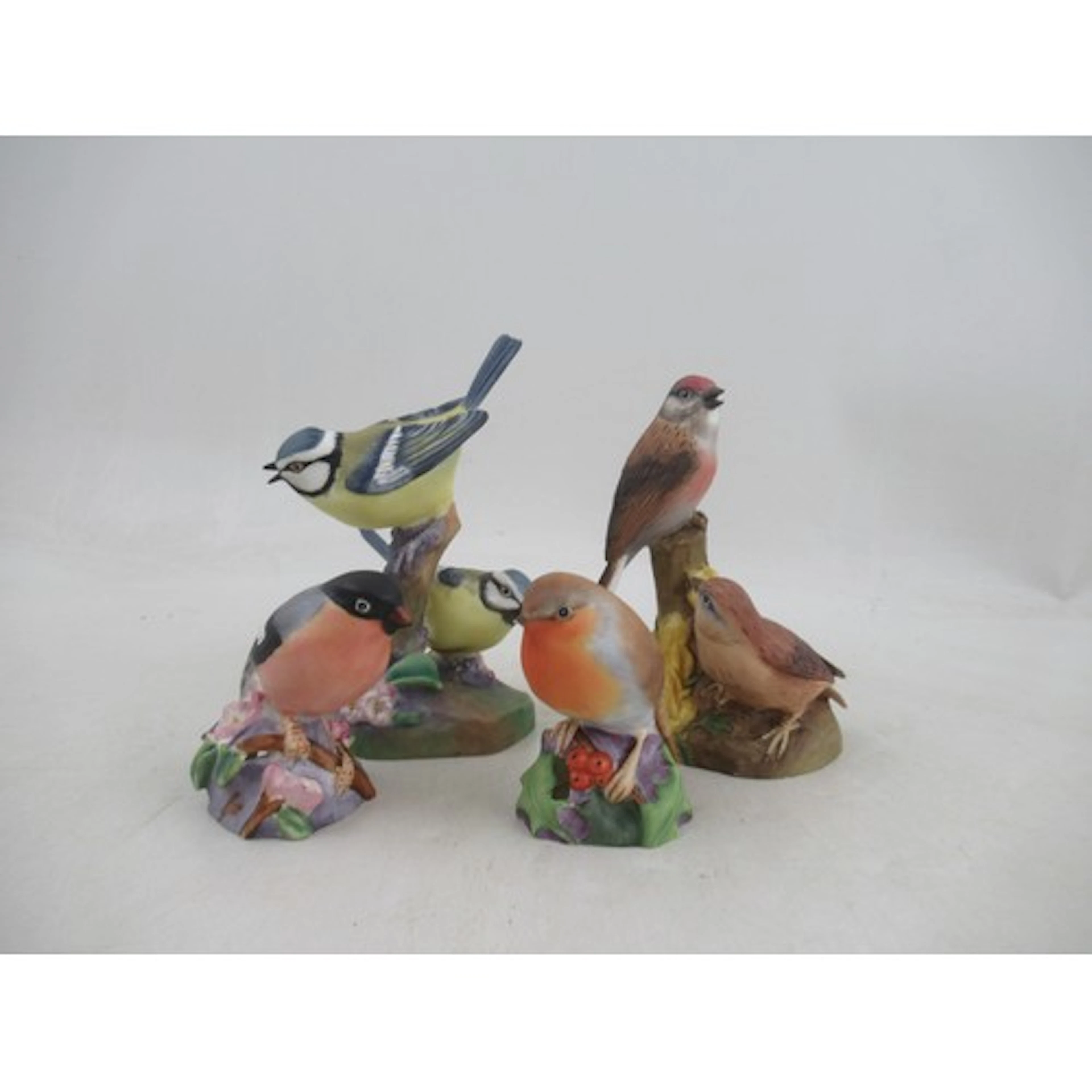 Four Royal Worcester bird models, double Blue Tits, double L...
