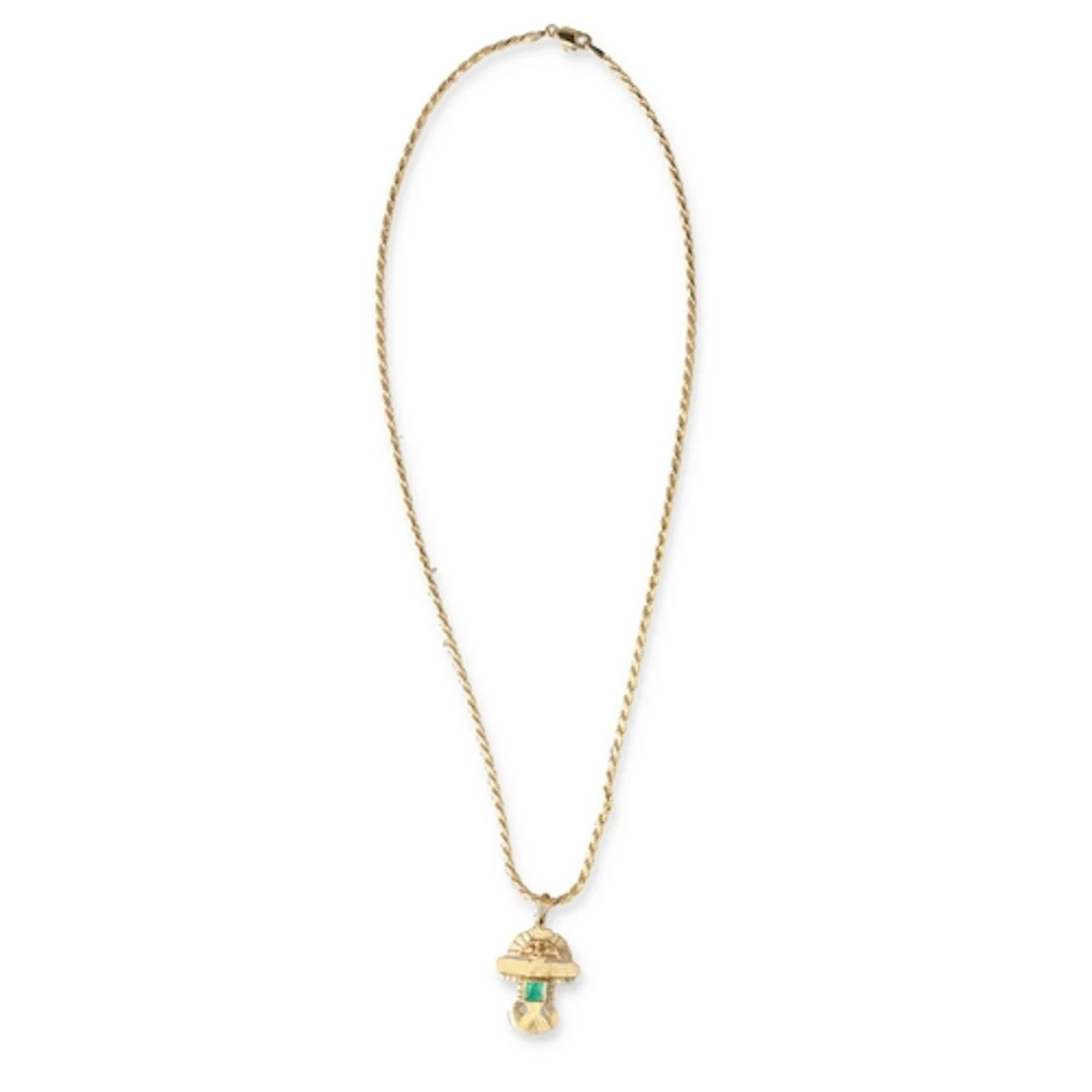 AN 18CT GOLD AZTEC STYLE PENDANT NECKLACE, SET WITH AN EMERA...