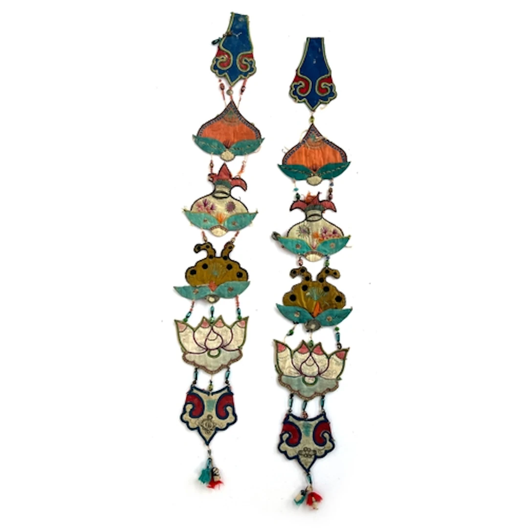 Two antique Chinese wall hangings, each comprised of six sma...
