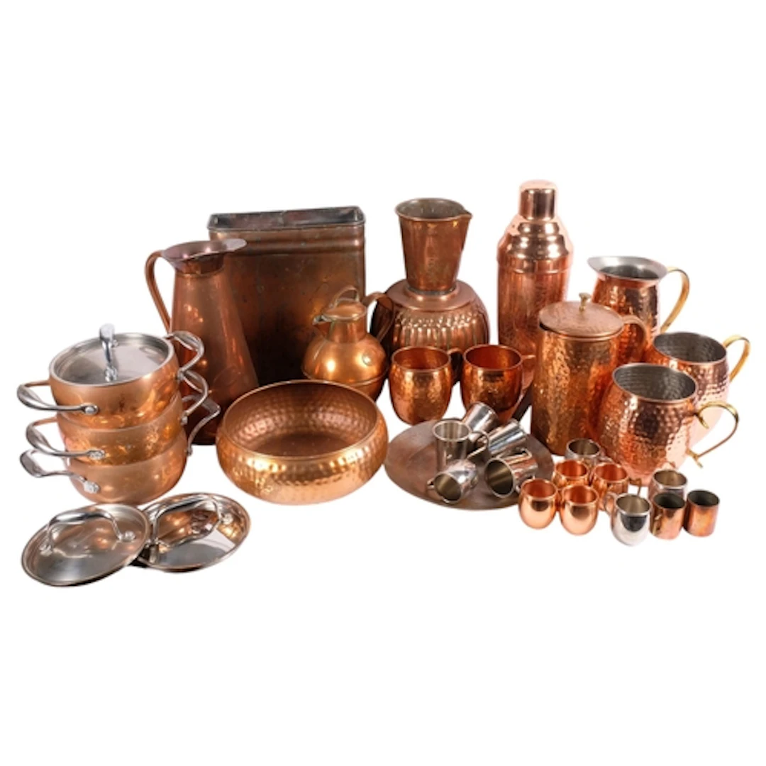 A box containing a large variety of brass and copperware, in...