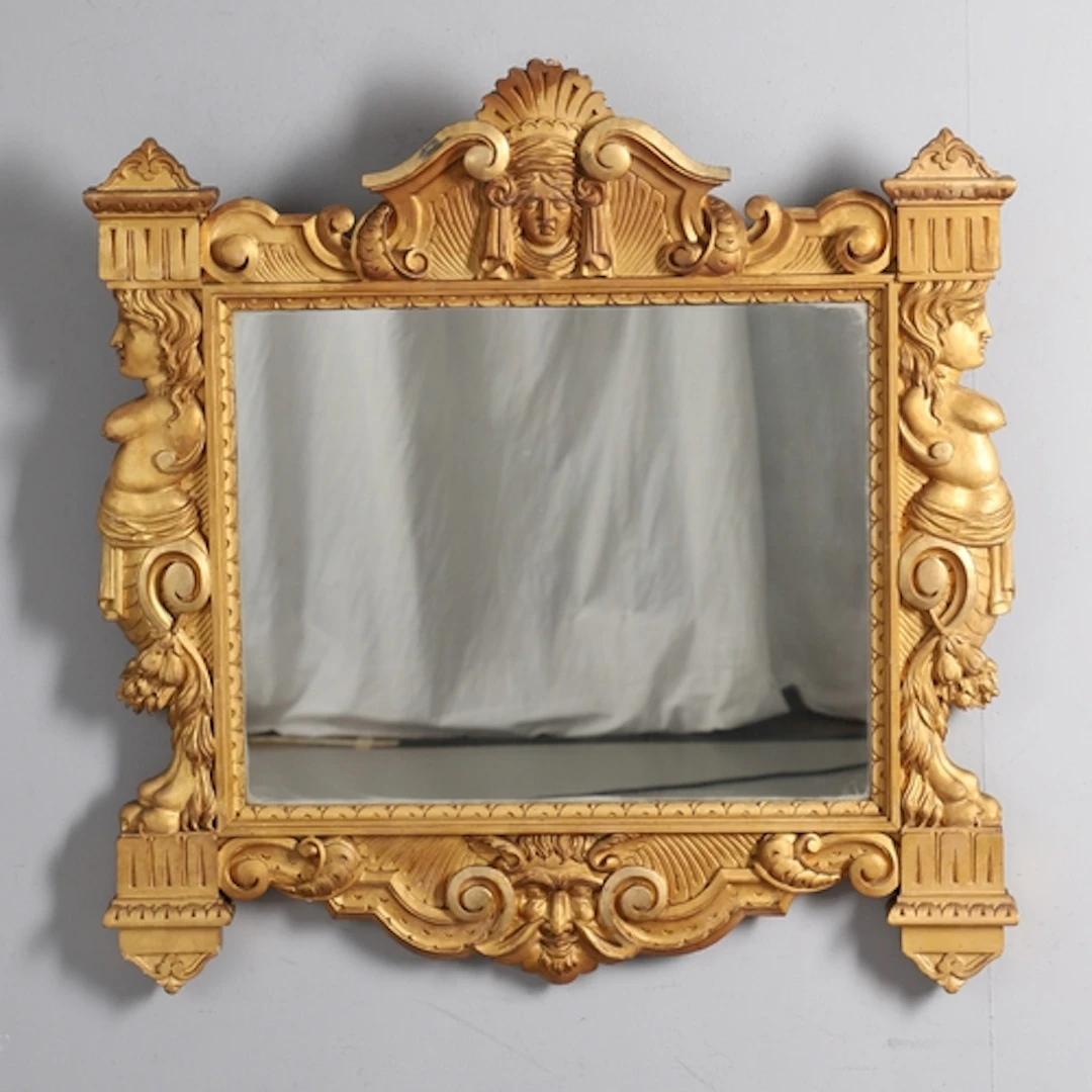 A 19TH CENTURY ITALIANATE GILTWOOD WALL MIRROR. the frame ca...