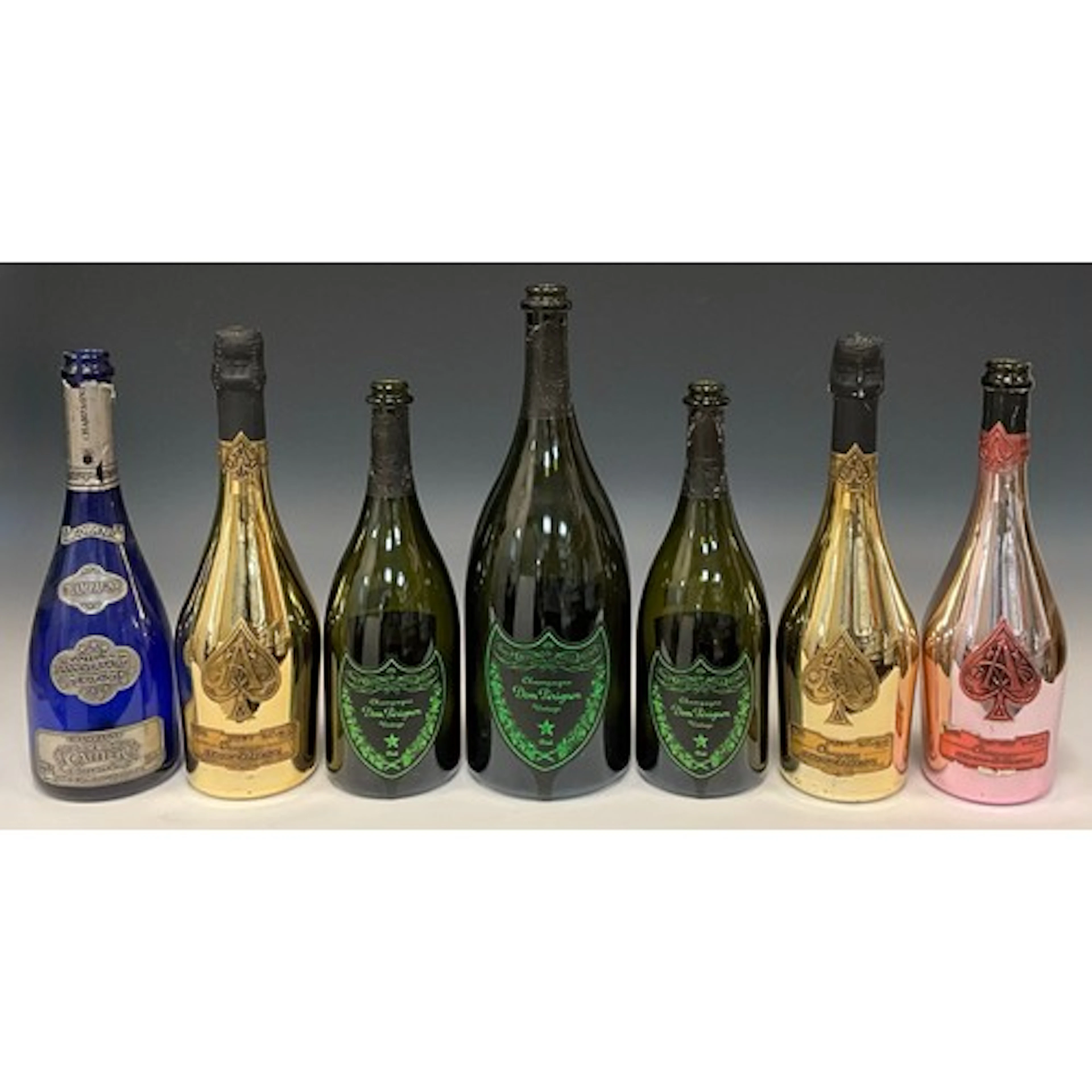 A trio of Dom Pérignon ‘Luminous’ Champagne bottles (empty),...