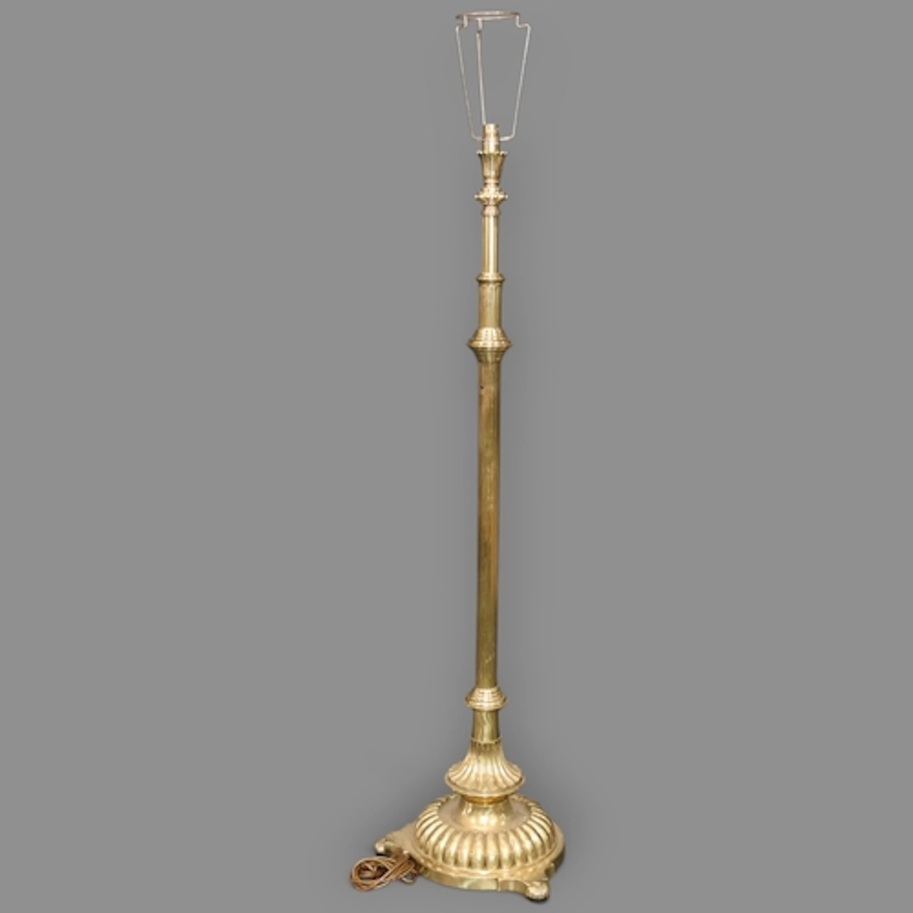 A heavy brass telescopic standard lamp, with fluted column a...
