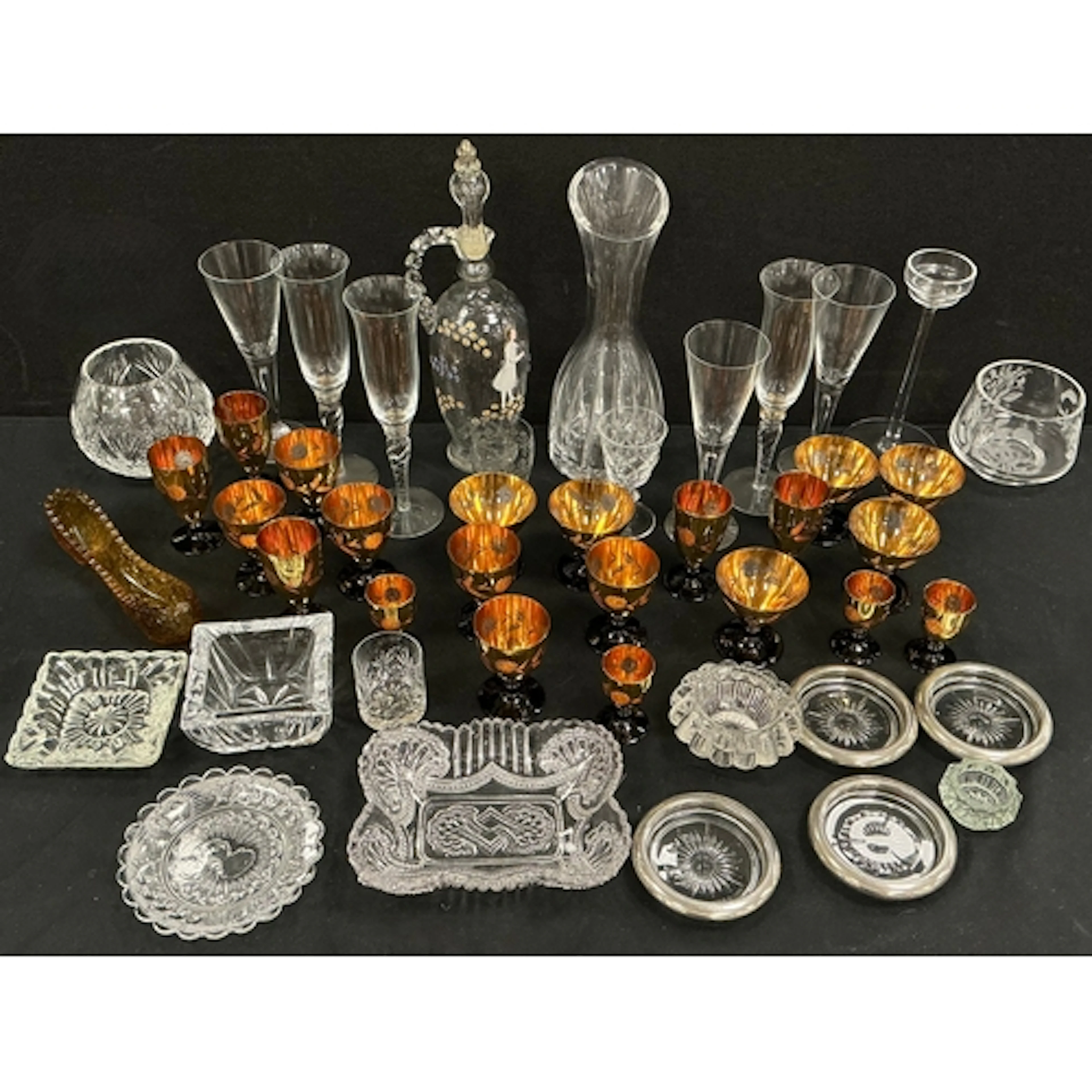 Glassware - etched copper toned glass of various sizes; a st...