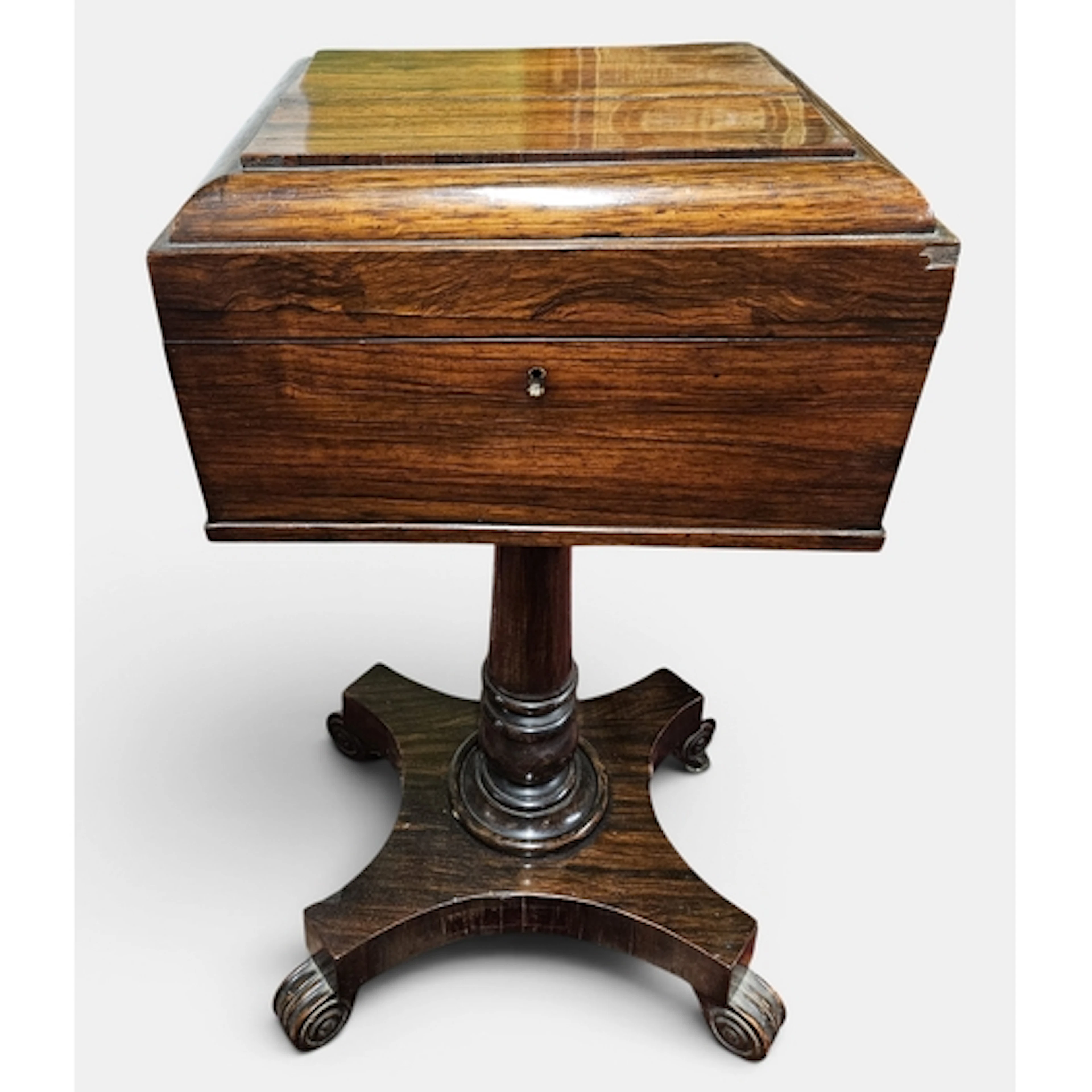 A 19th Century Rosewood Teapoy with fitted interior on turne...