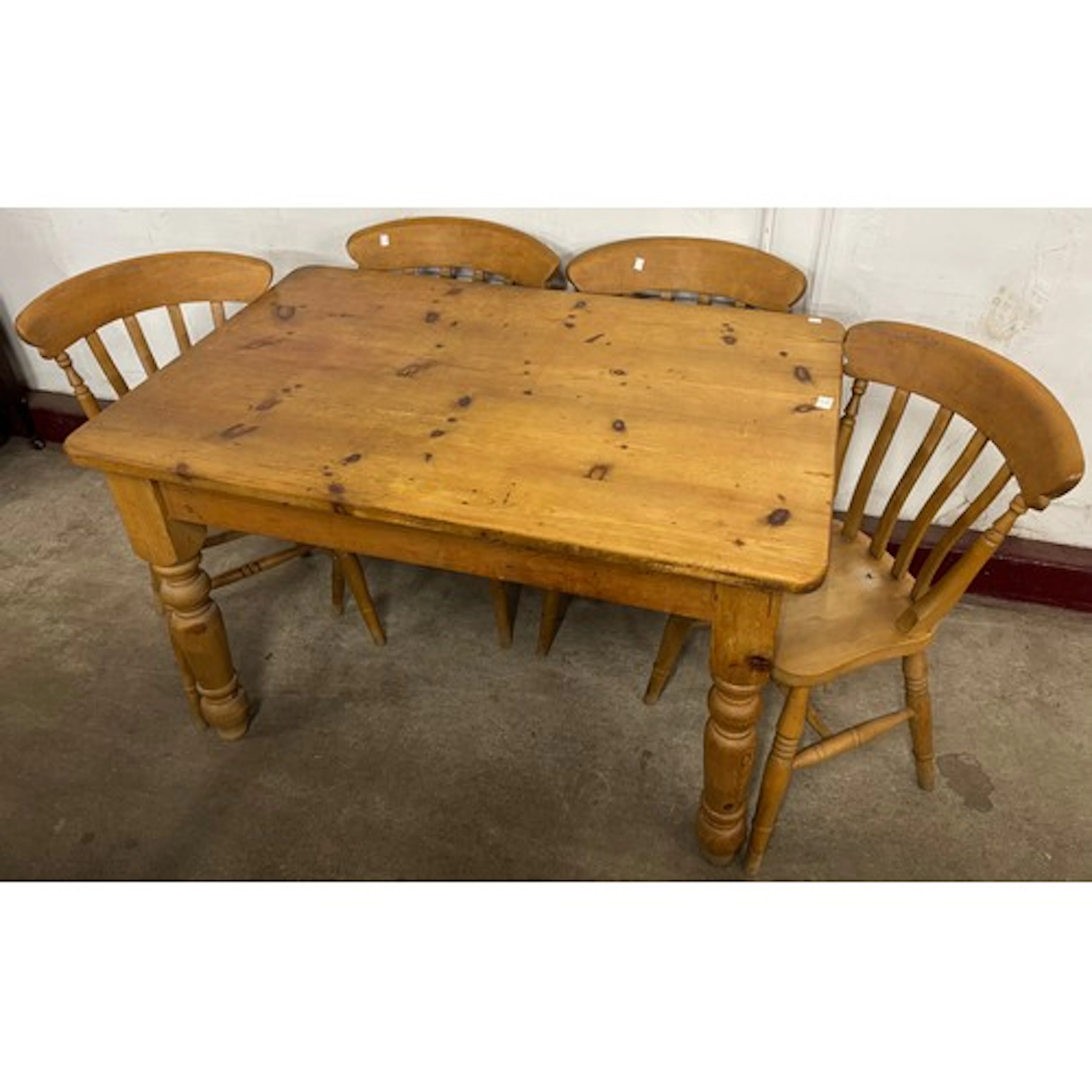 A Victorian style rectangular pine dining table and four bee...