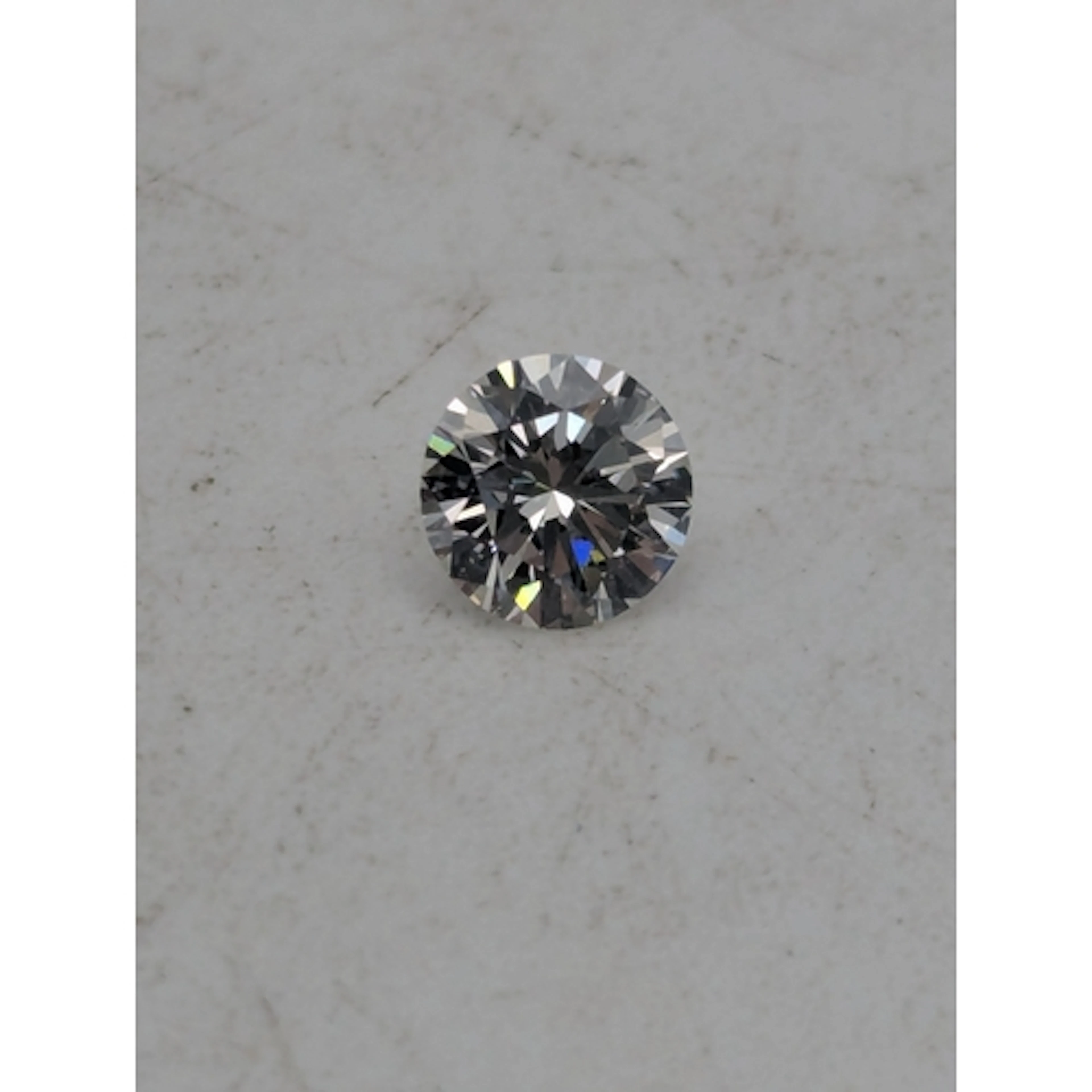 A 0.52ct round cut diamond, colour J, clarity VVS1, measurin...