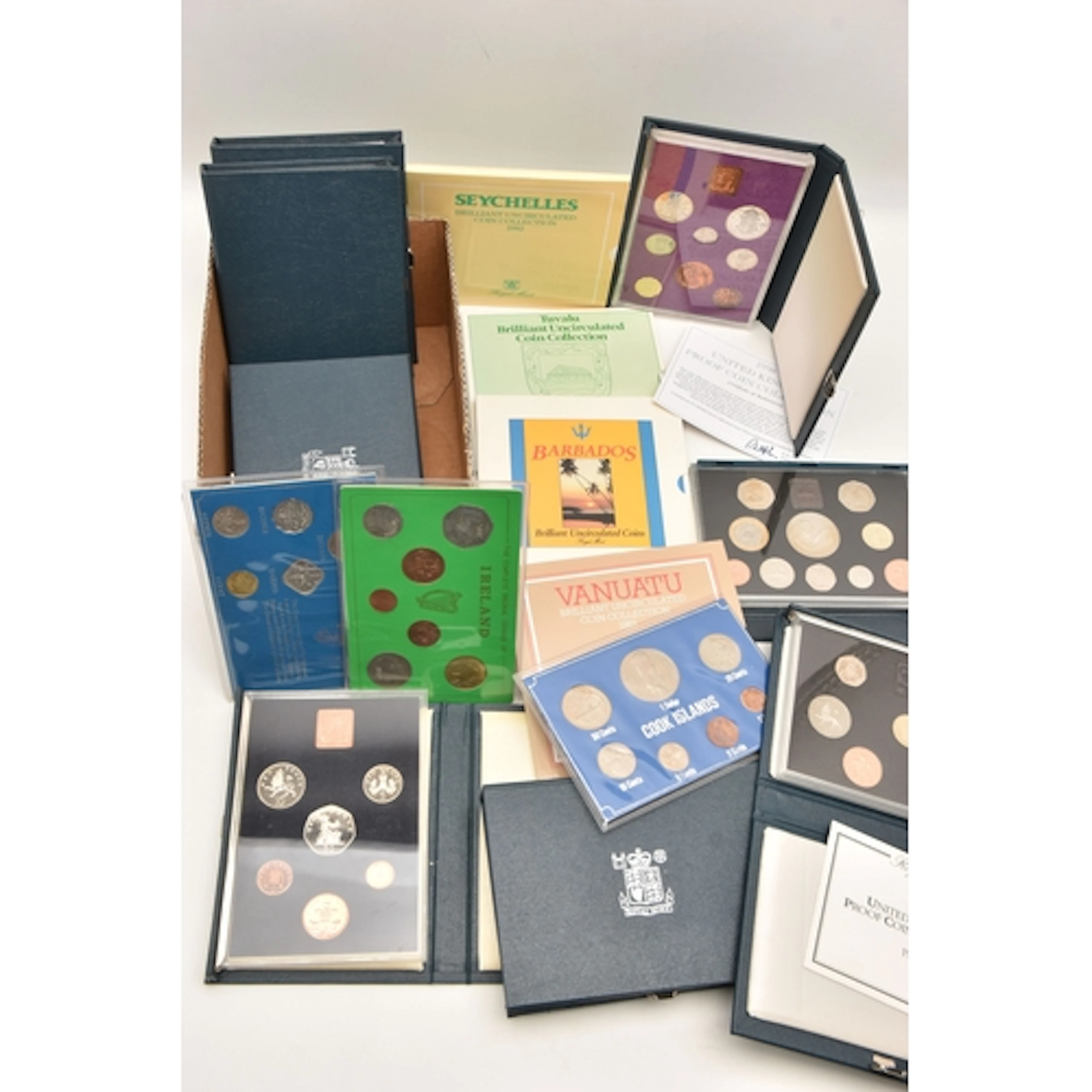 A BOX OF PROOF COIN SETS Including Bahamas, Cook Islands, Ir...