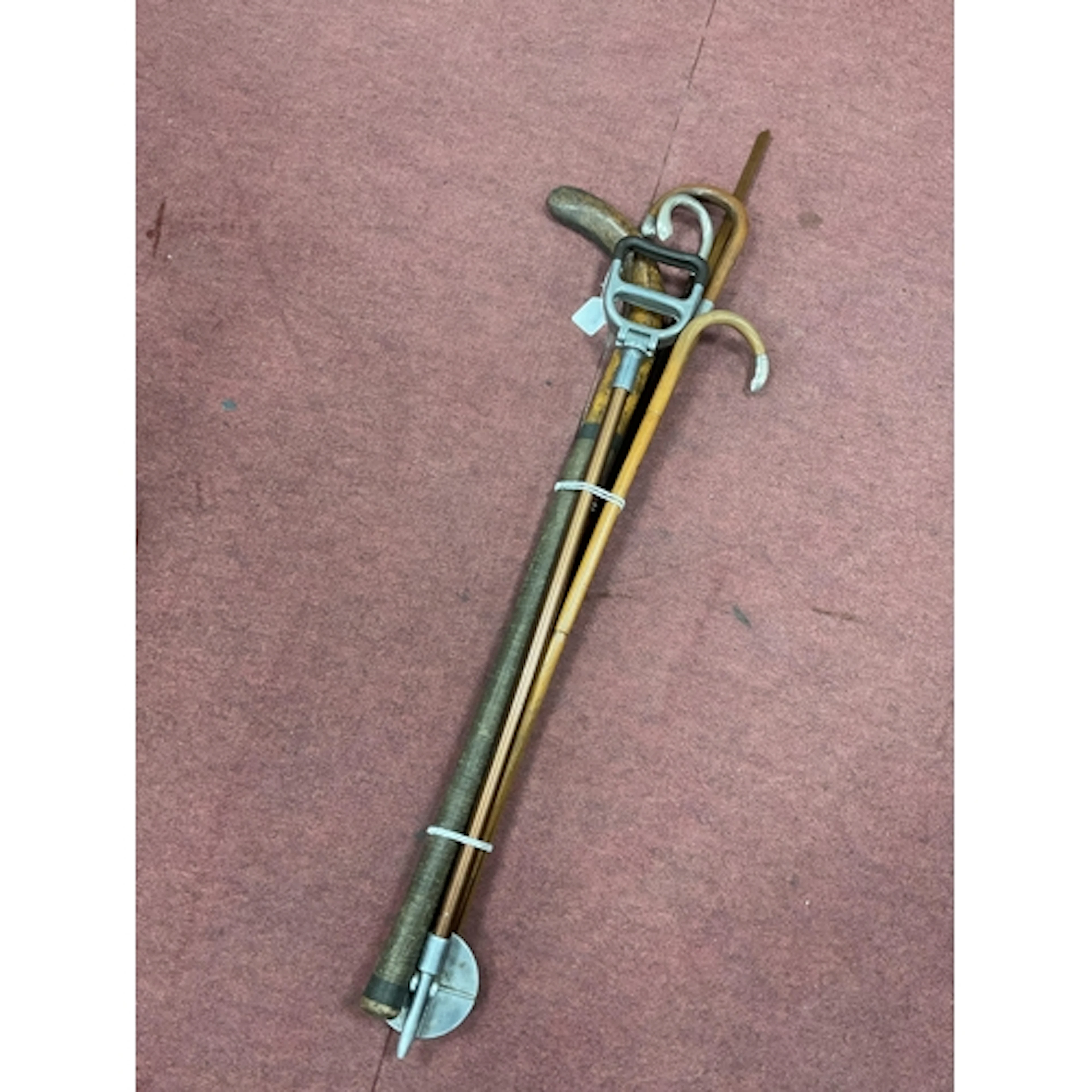 A Silver Handled Umbrella Cane, two silver-tipped canes, sho...
