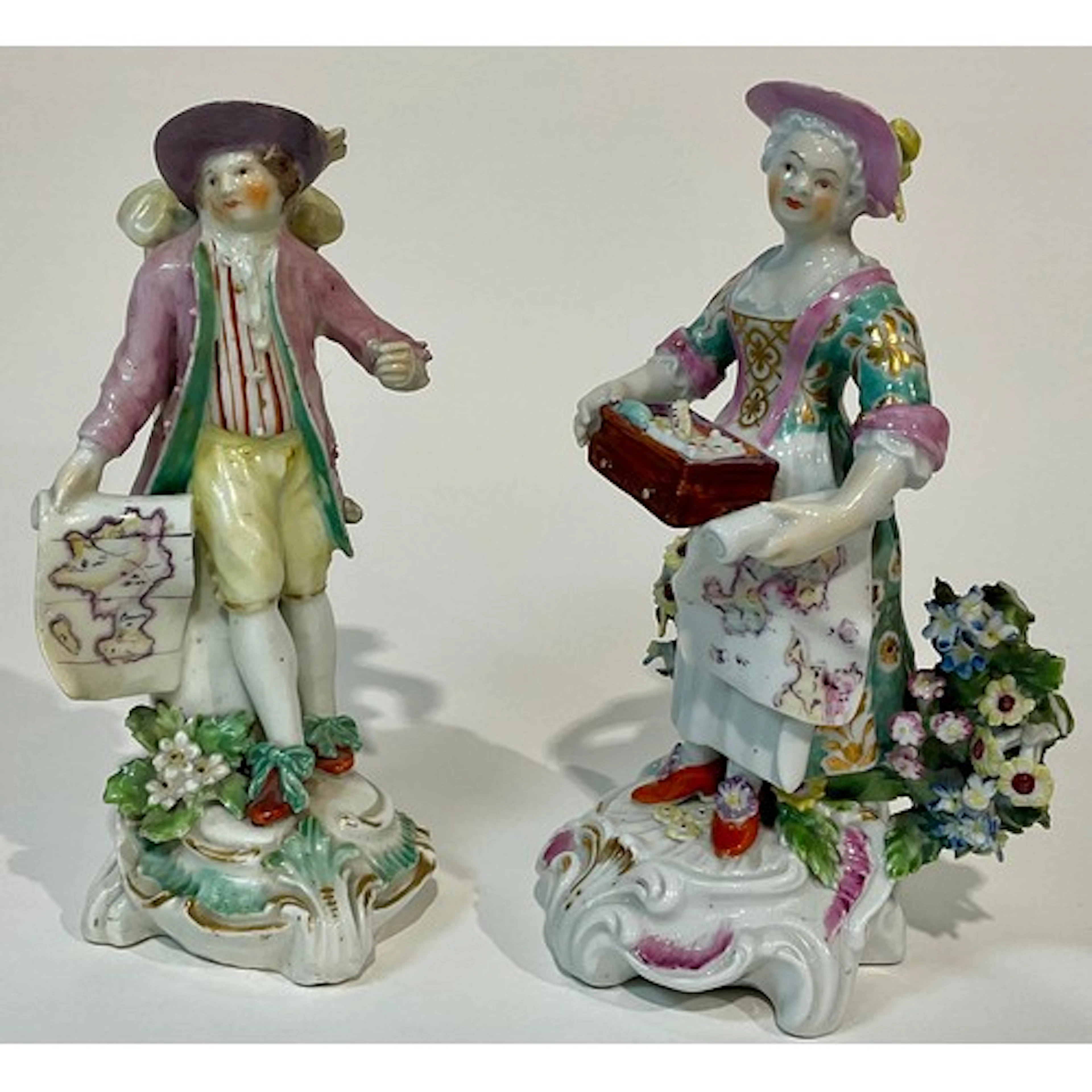 A matched pair of Derby figures, Map Seller and his Companio...