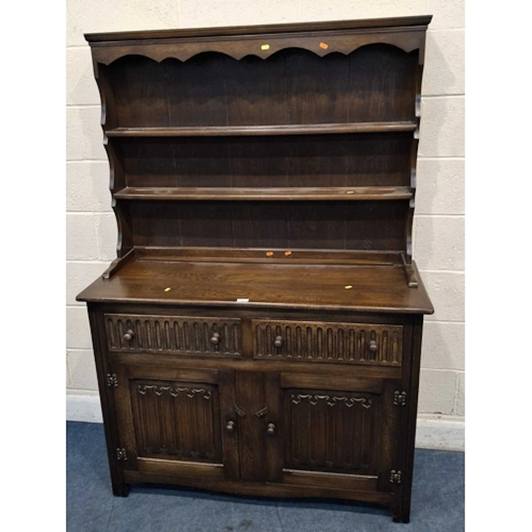 A 20TH CENTURY OAK DRESSER, the three-tier plate rack atop a...