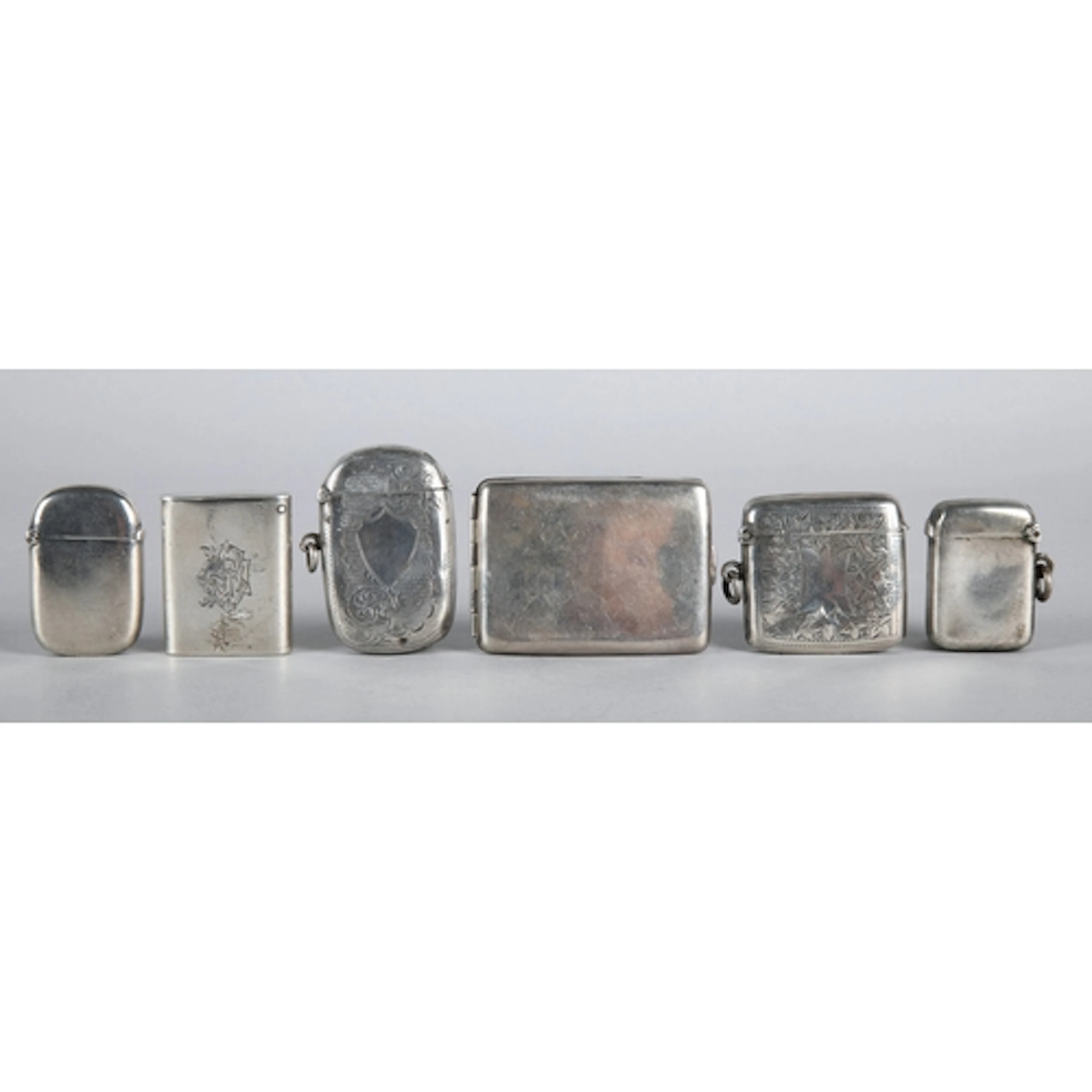 Collection of five silver vesta cases and a silver cigarette...