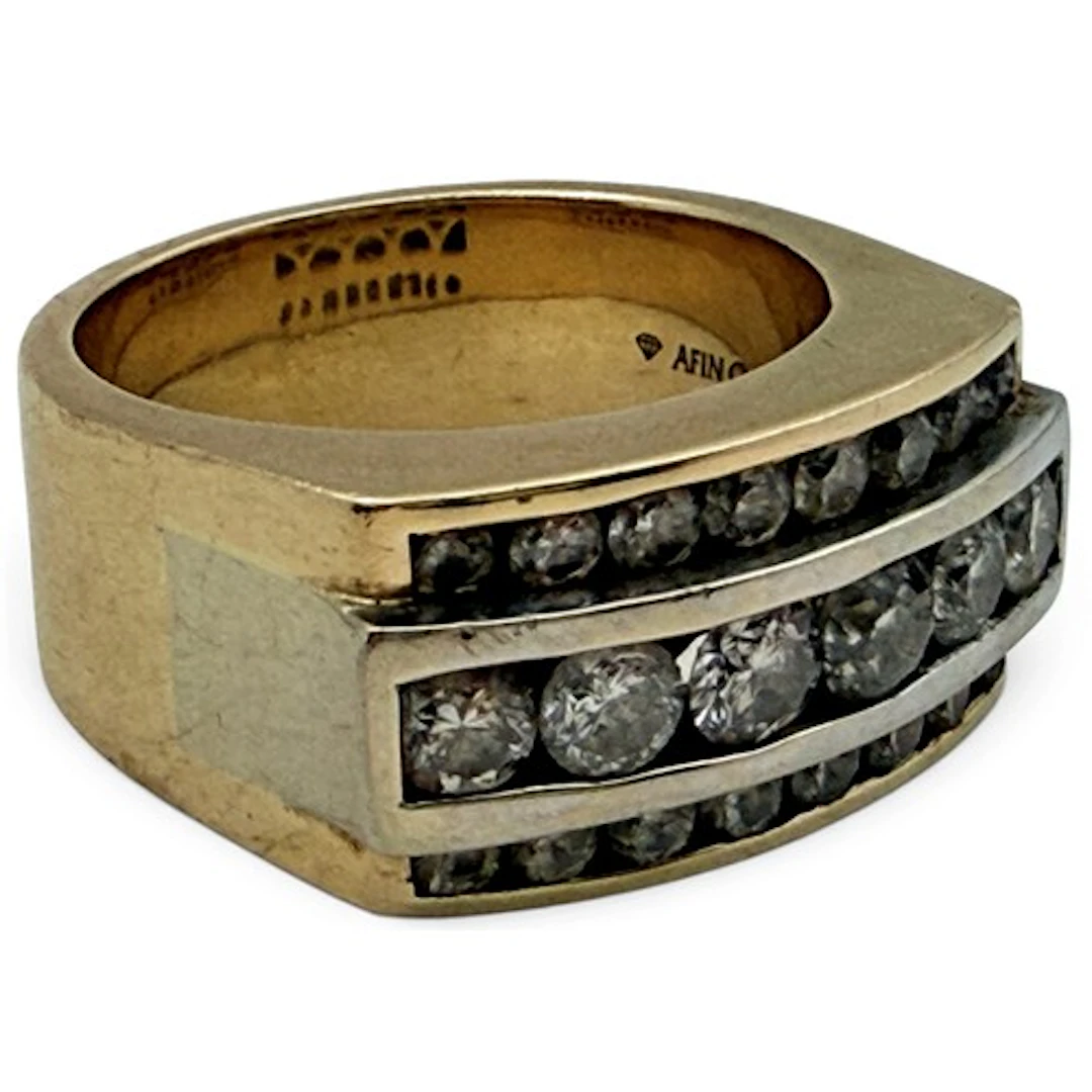 A gentleman's diamond ring, centred with a row of six tensio...
