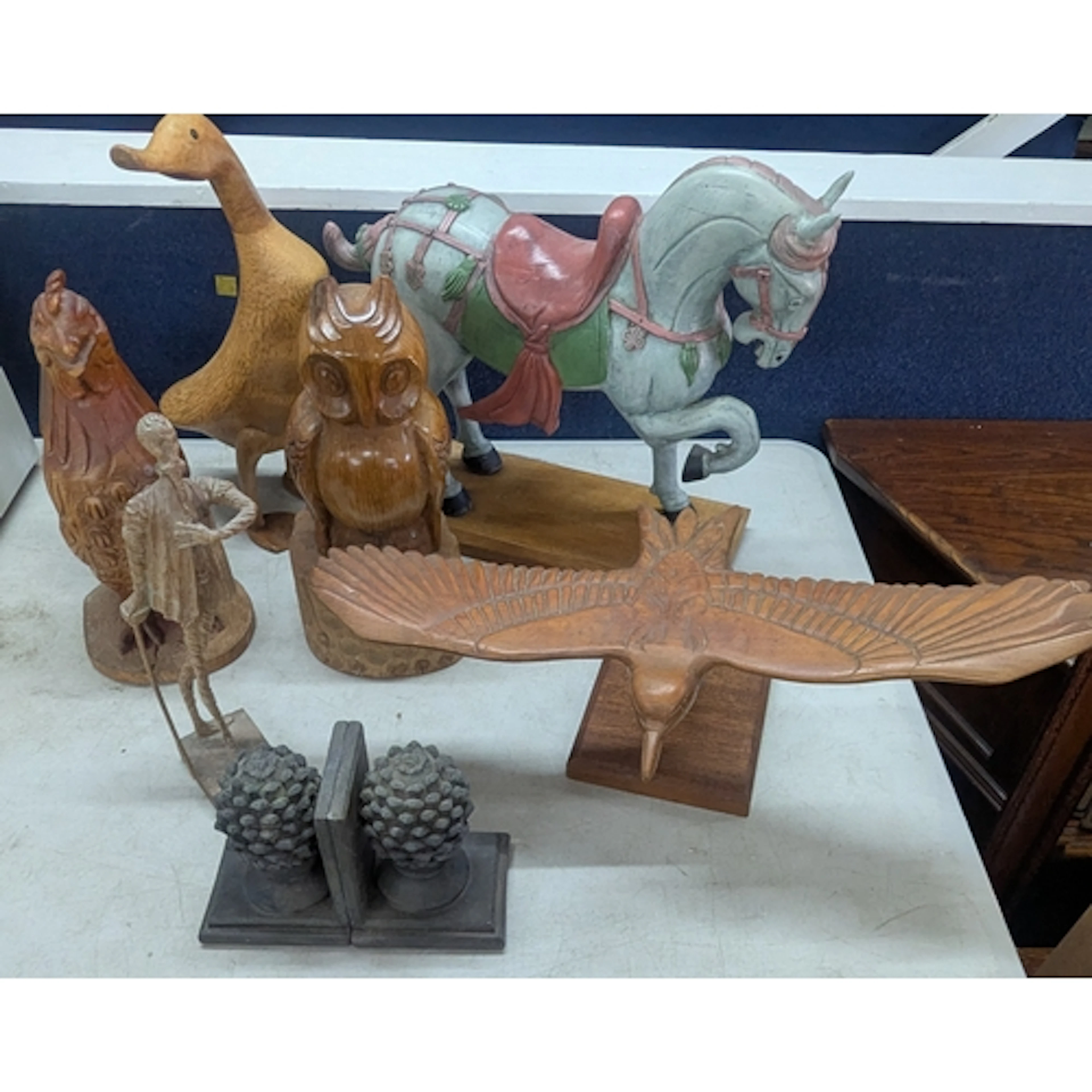 A group of wood carved sculptures, to include a Tang Dynasty...
