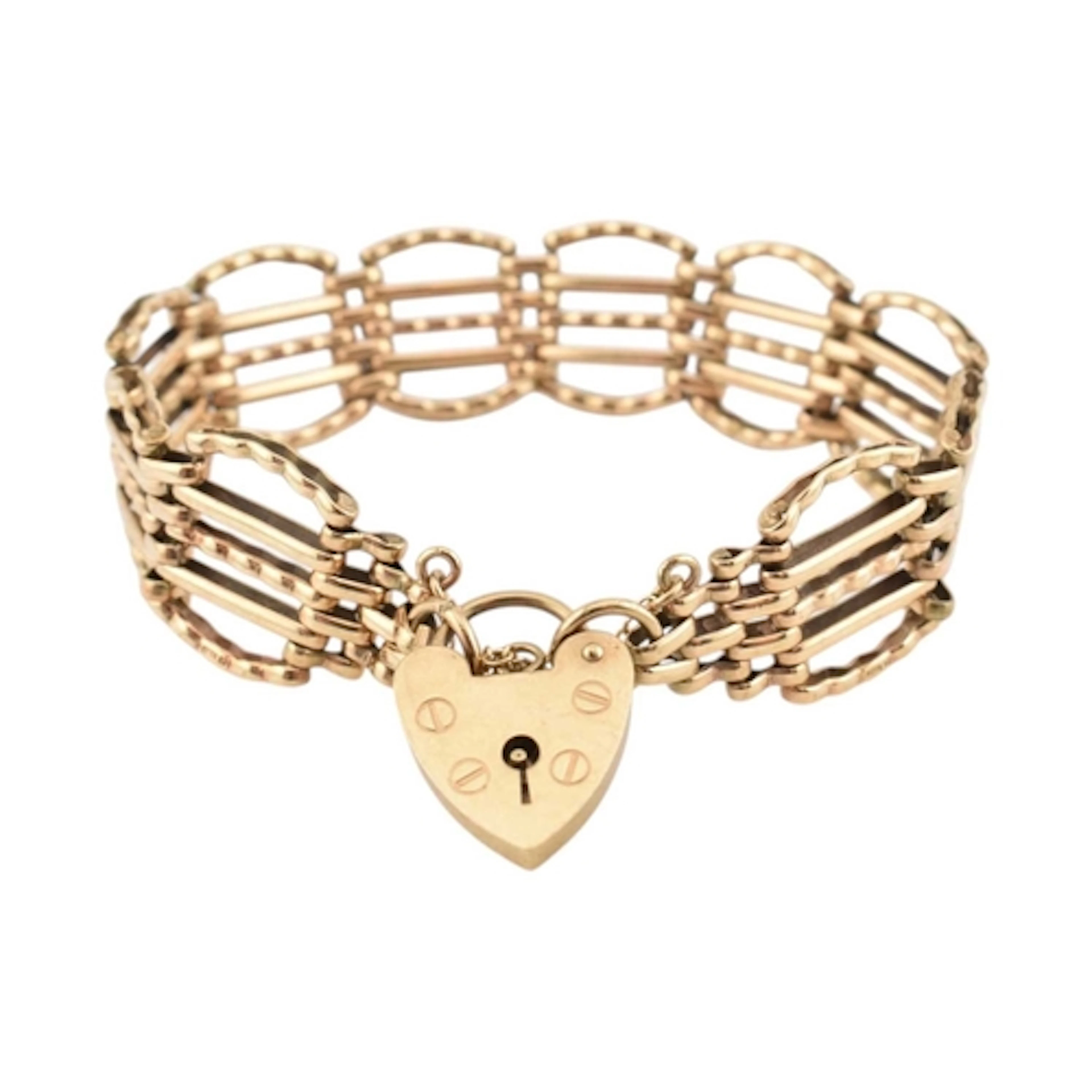A 1970s hallmarked 9ct gold five bar fancy gate link bracele...