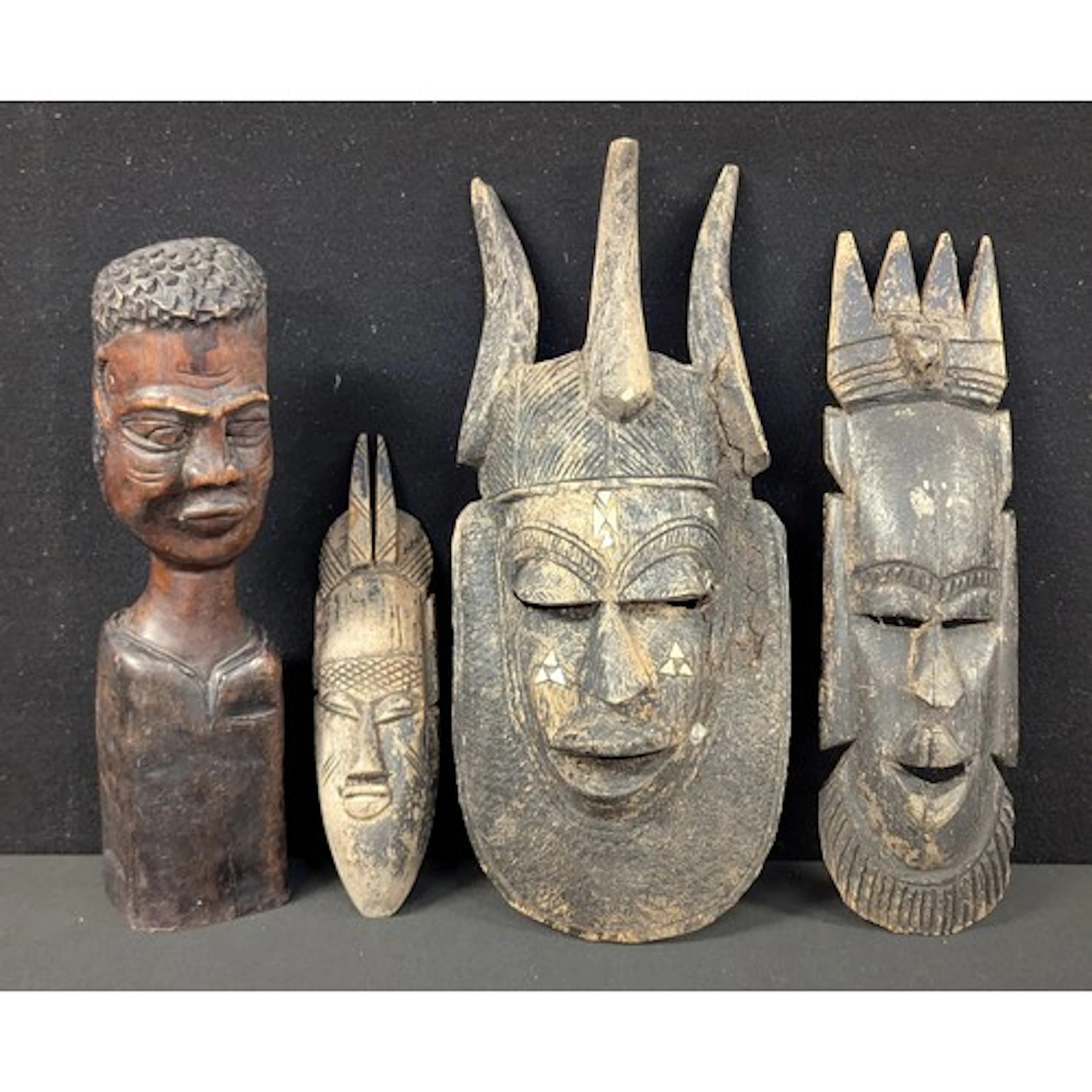 Tribal Art - A West African ceremonial mask, deep scarificat...