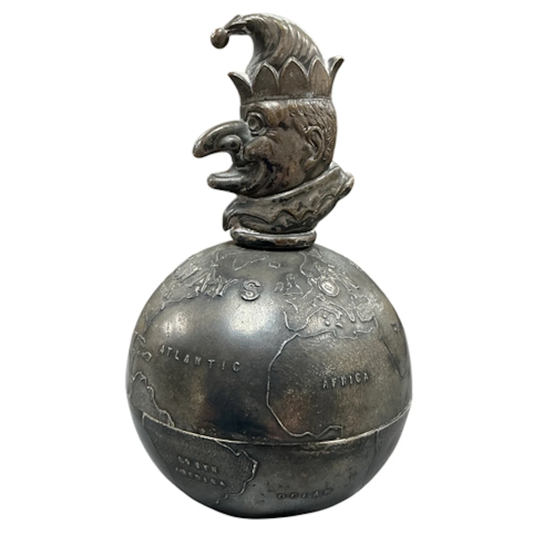 A Punch 'Always on Top' globe paperweight, electroplate, hei...