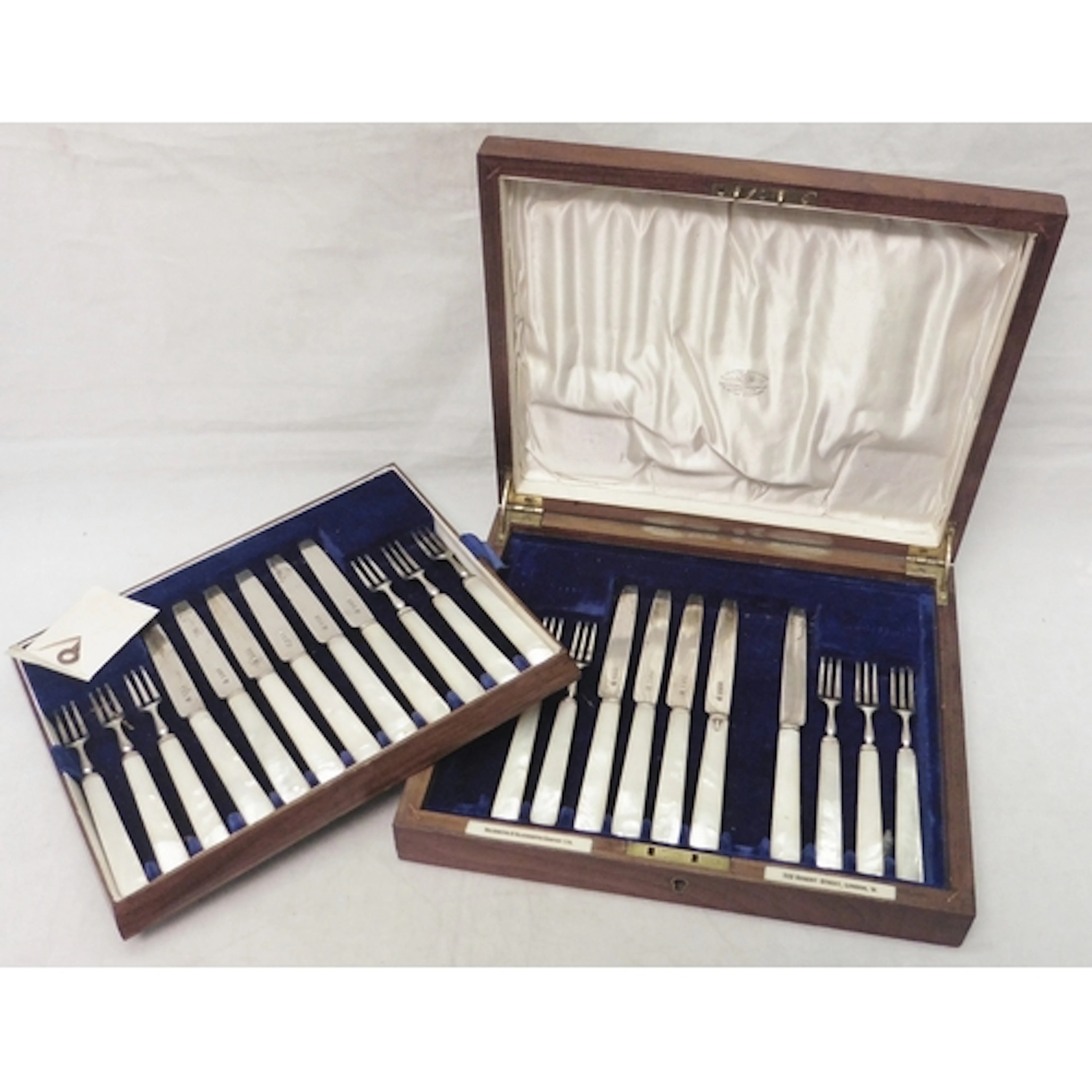 An Edwardian cased part canteen of mother of pearl handled s...