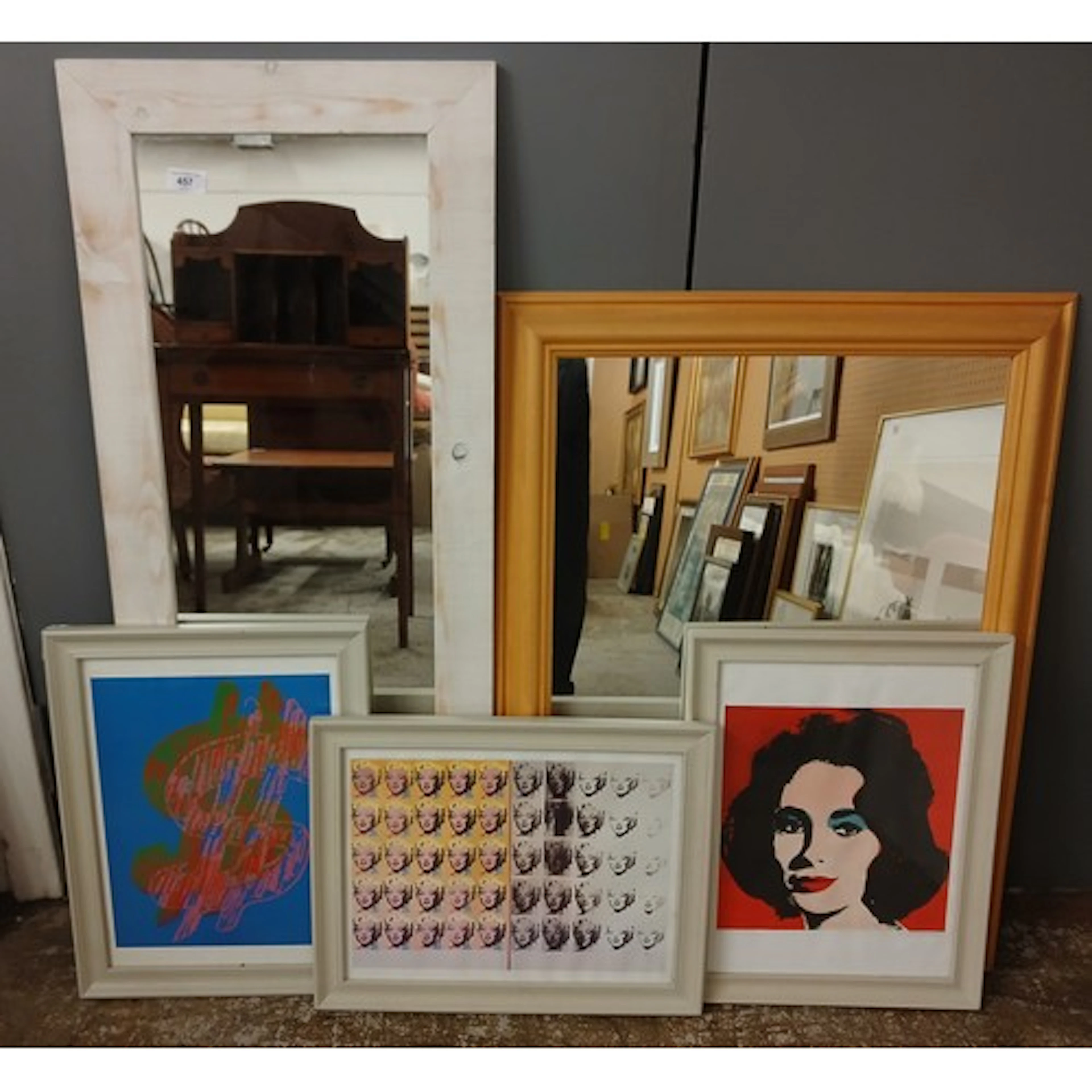 Three framed Andy Warhol prints and two framed mirrors.