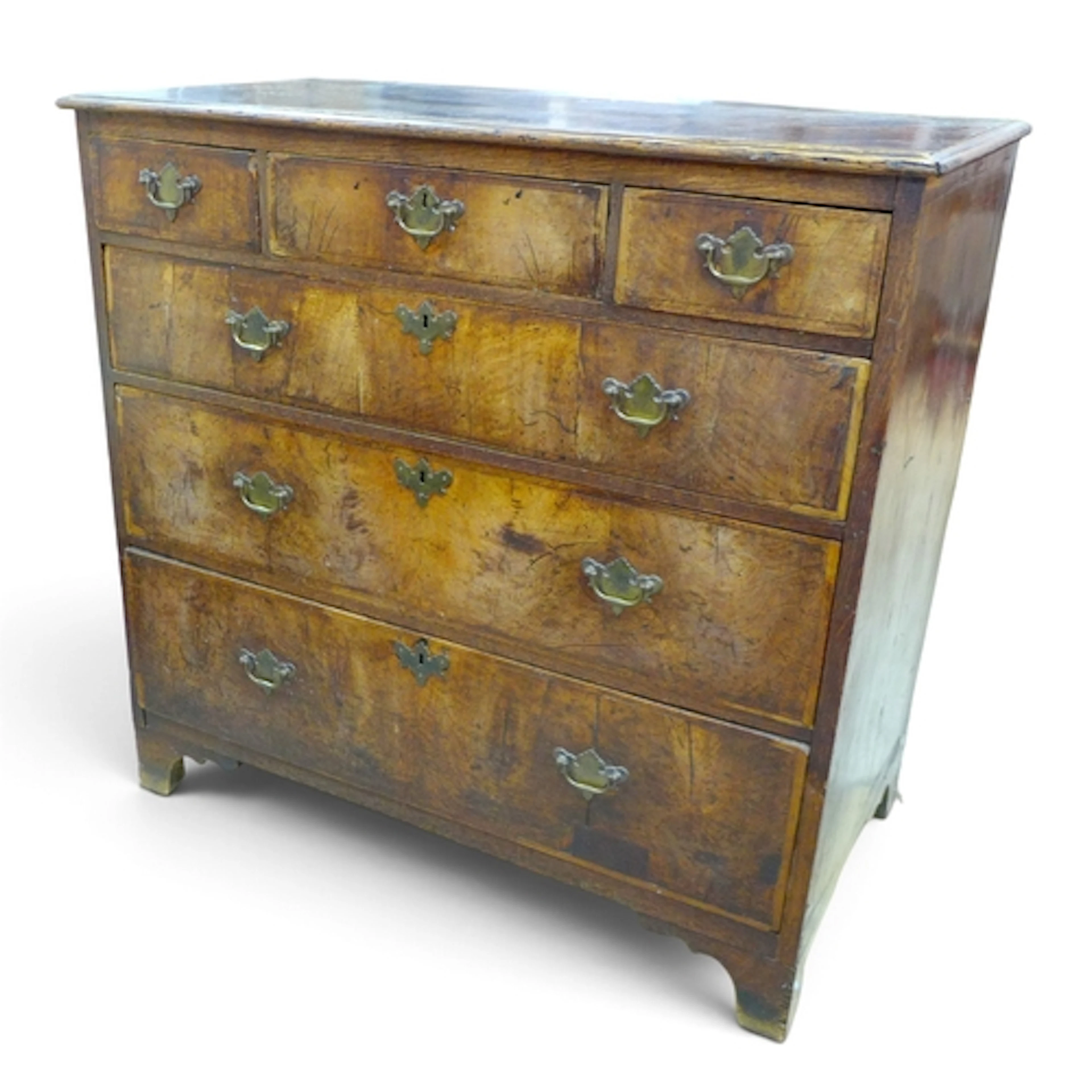 A GEORGE III MAHOGANY CHEST. with an oak top over three smal...