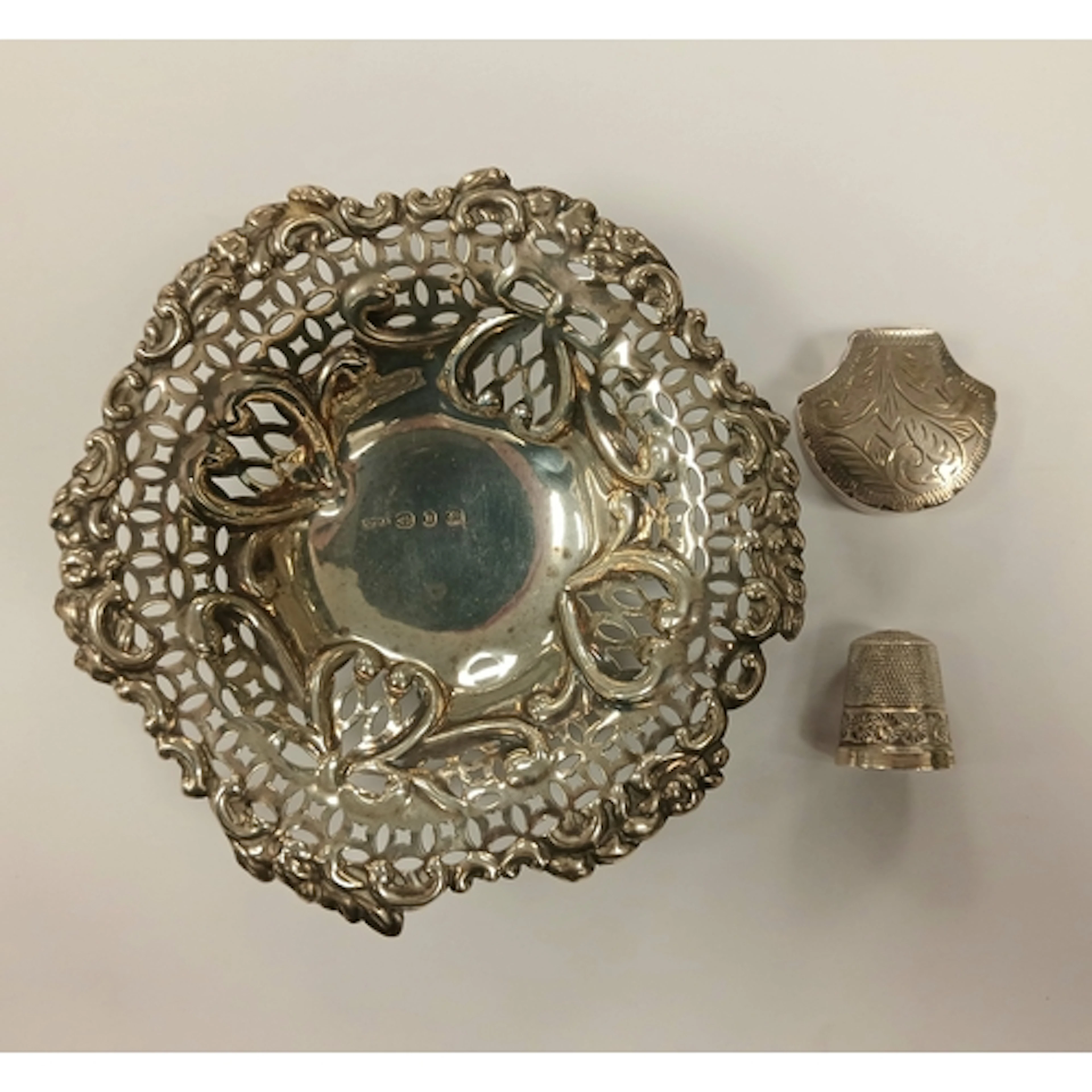 Silver pierced bon bon dish, a sterling silver box in shell ...
