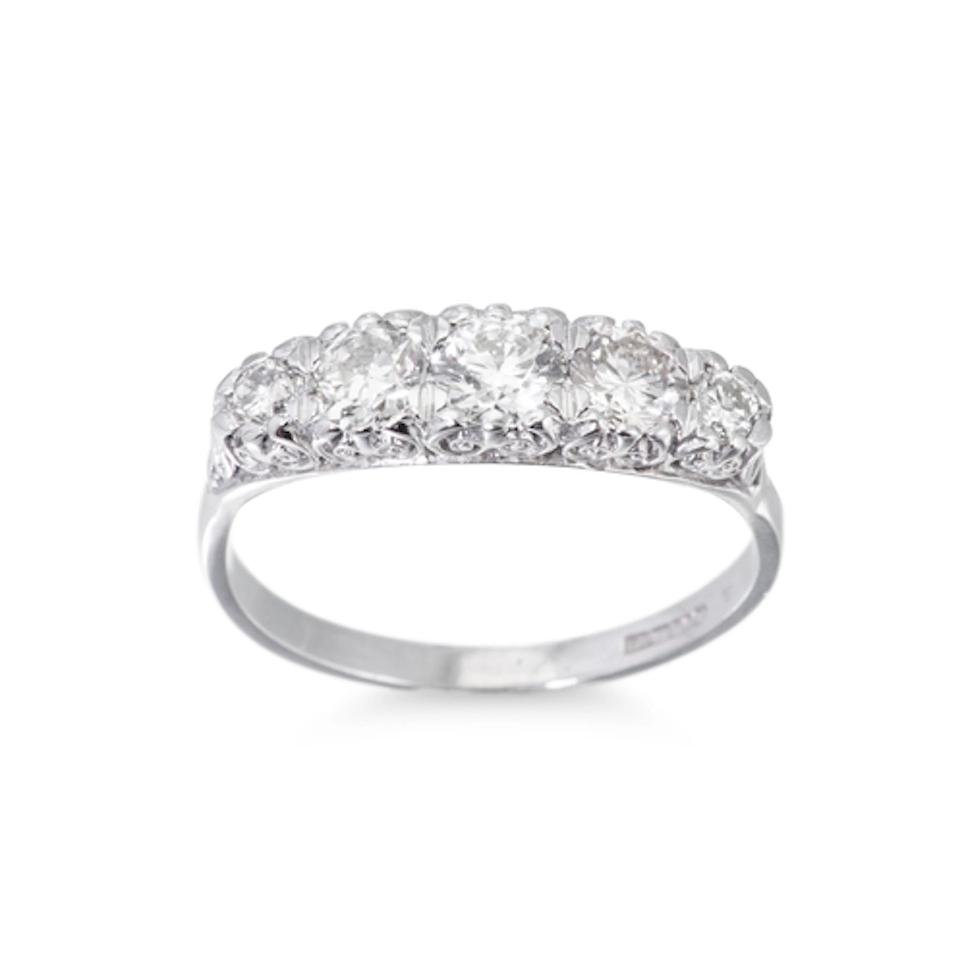 A FIVE STONE DIAMOND RING, the brilliant cut diamond to carv...