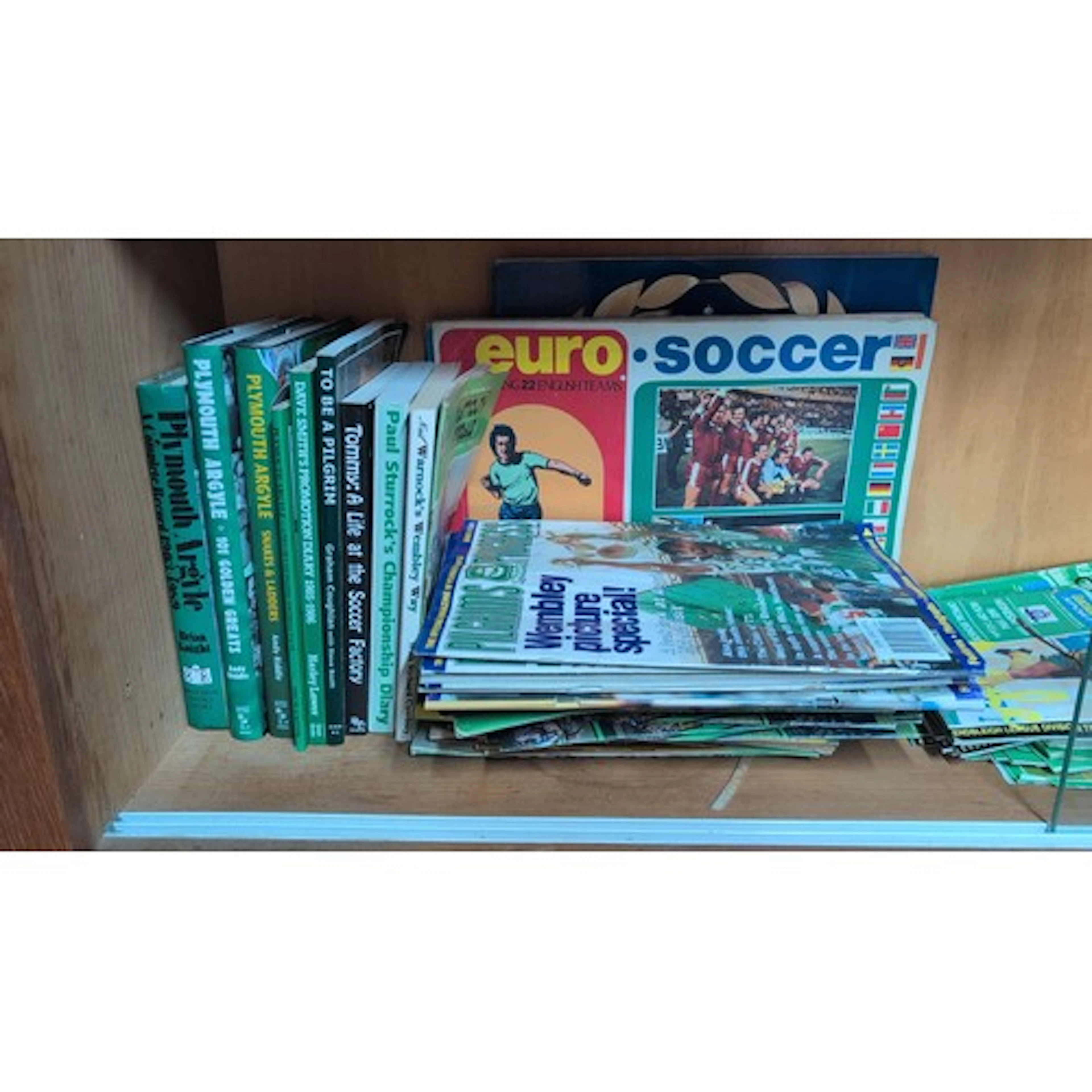 A group of football ephemera and memorabilia, including Plym...