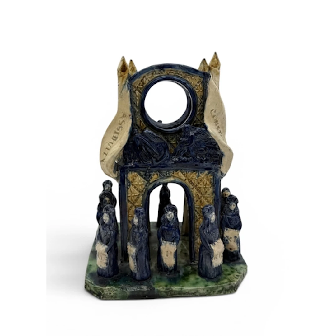 A VICTORIAN STAFFORDSHIRE GLAZED CERAMIC WATCH STAND WITH FI...