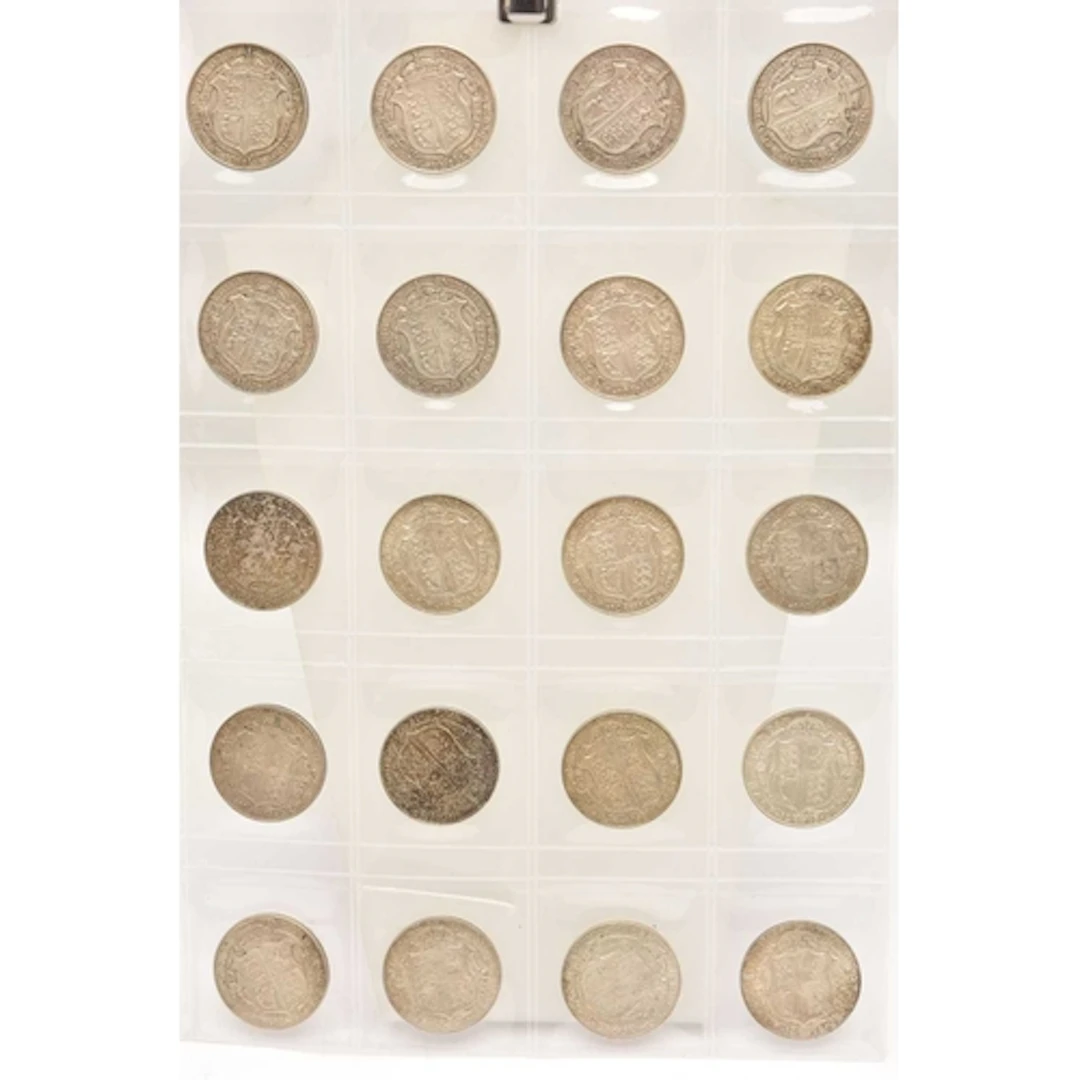 Silver. A page from a coin album containing 20 x King George...