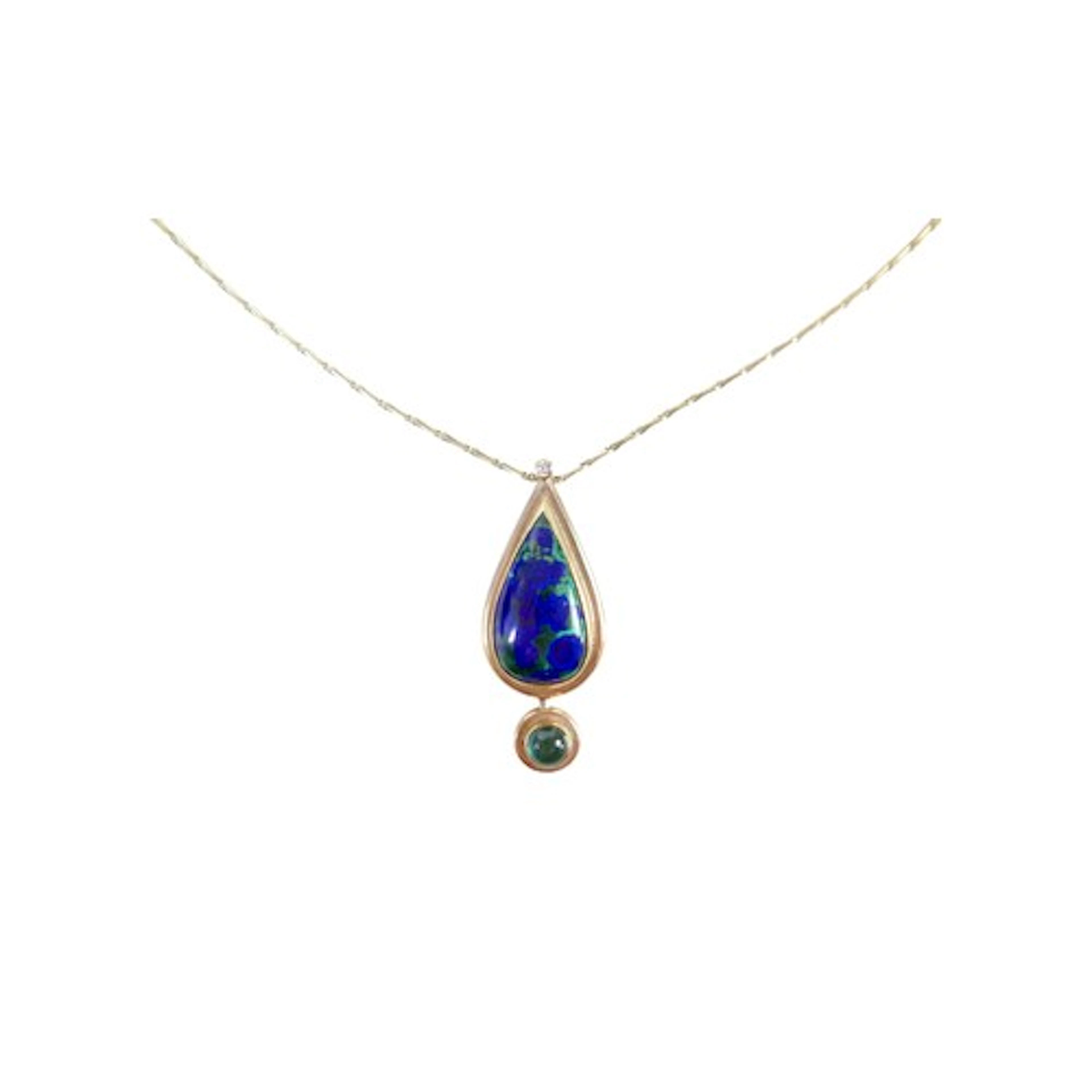 A 9ct yellow gold teardrop pendant on gilt chain, set with a...