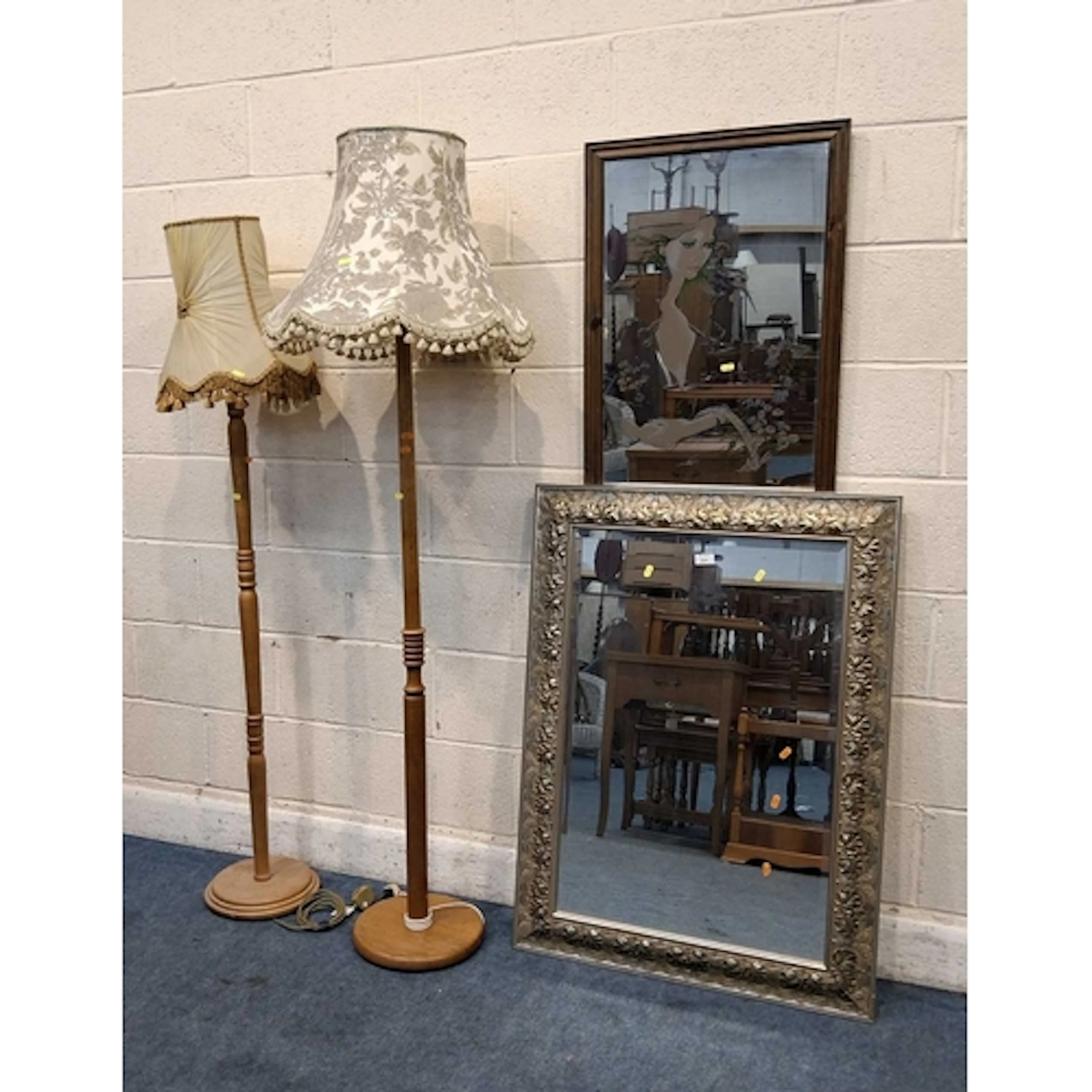 A RECTANGULAR BEVELLED EDGE WALL MIRROR, with foliate detail...