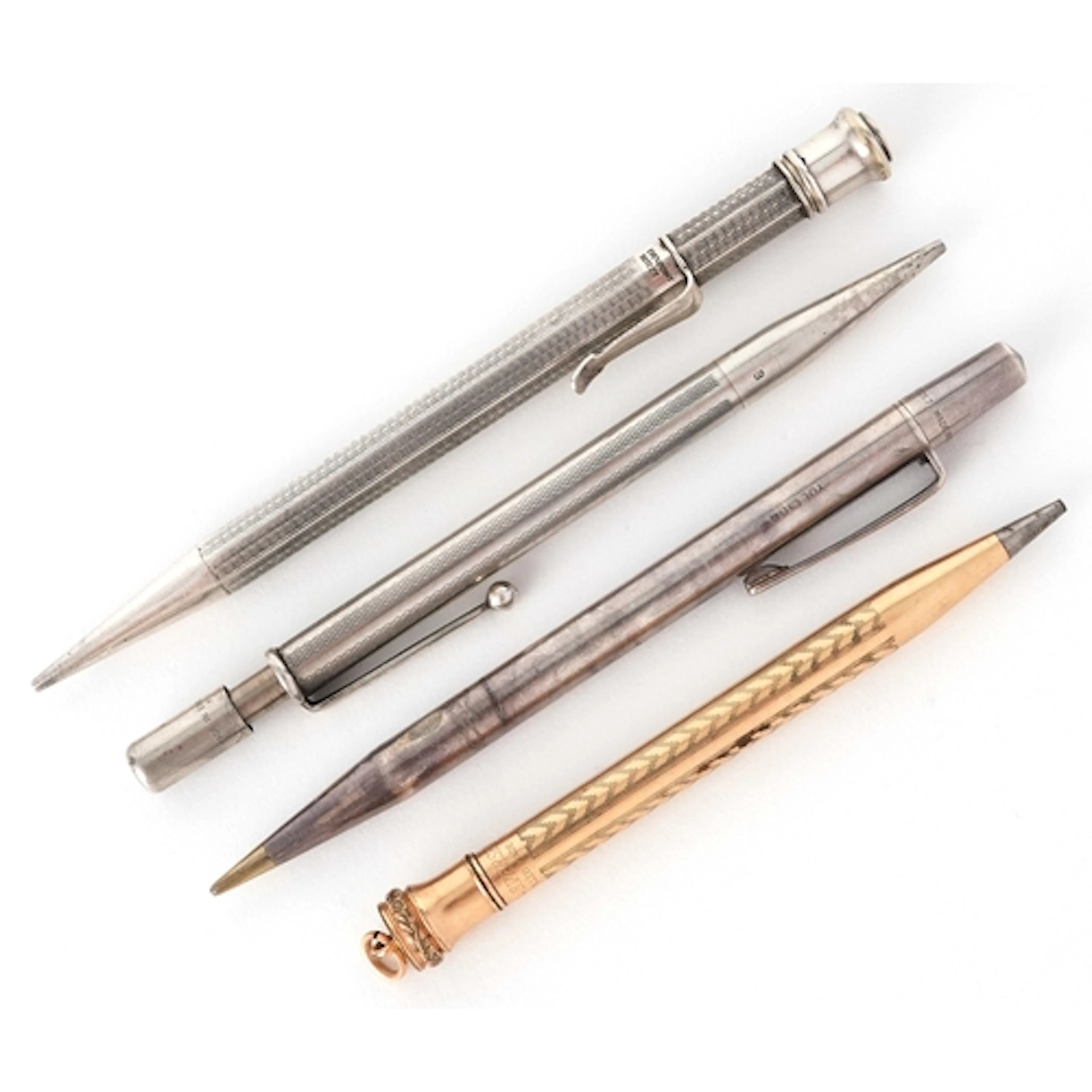 Four antique propelling pencils including two silver example...