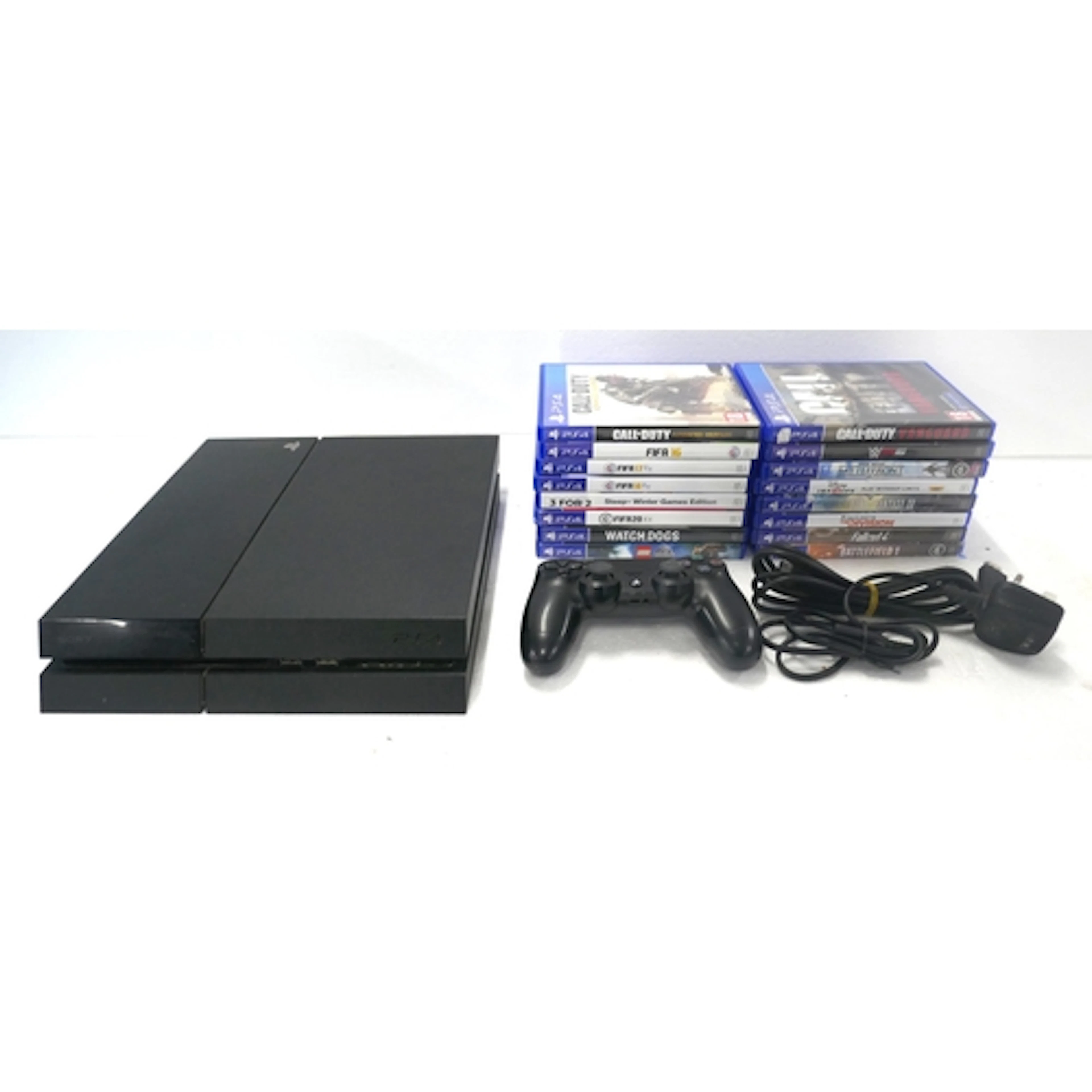A PlayStation 4 games console with a PlayStation 4 wireless ...