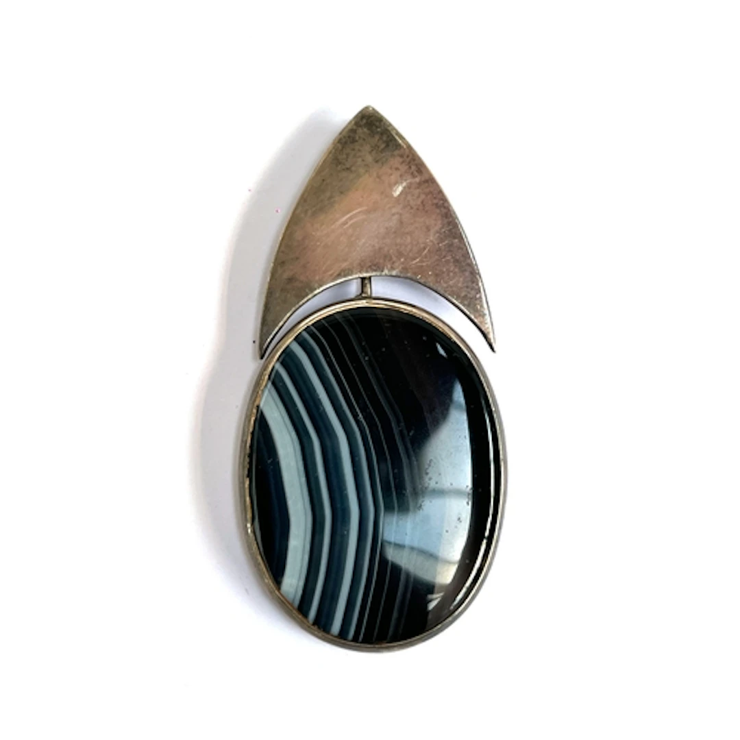 A modernist silver and banded agate pendant, hallmarked MB, ...
