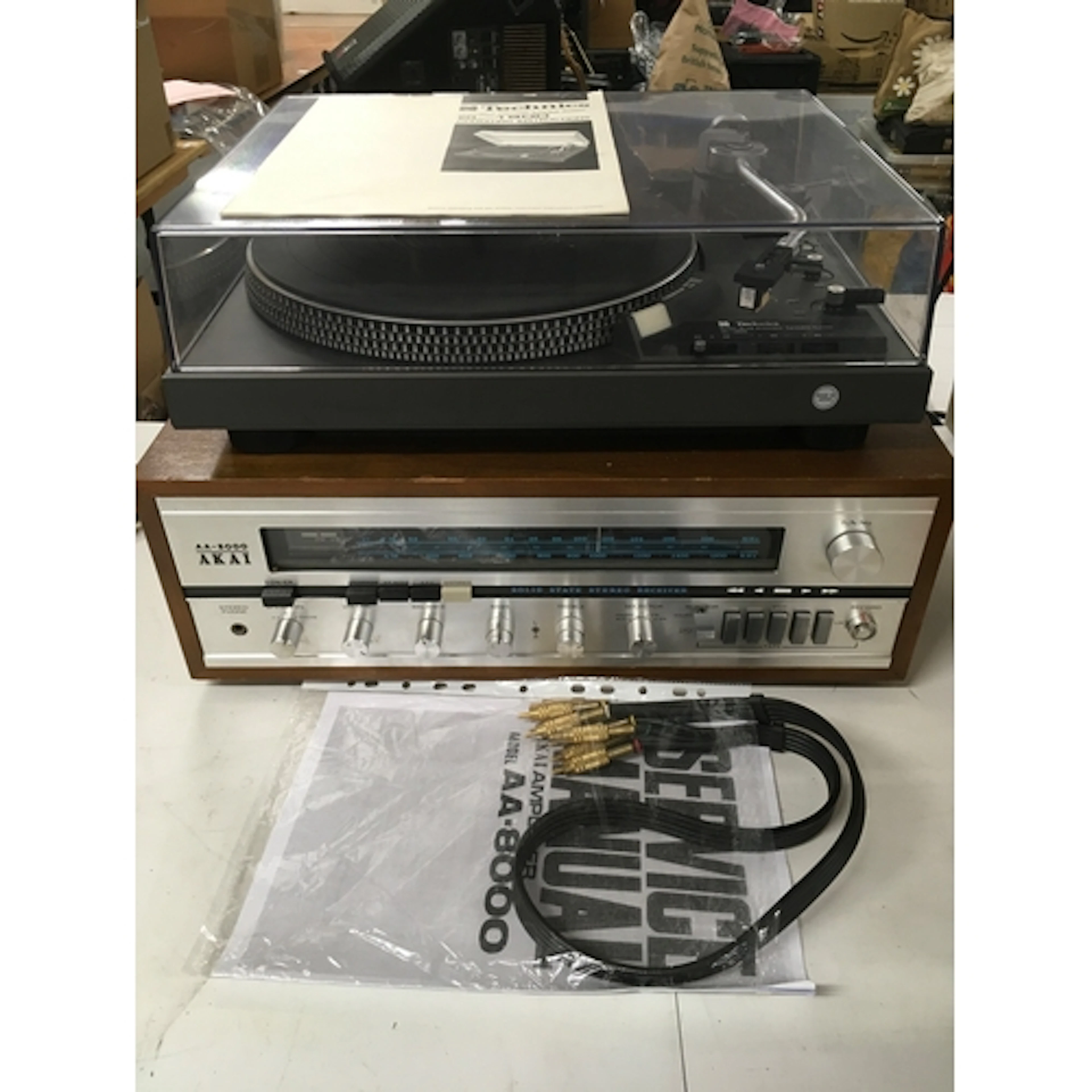 A Technics SL1900 record player and an Akai AA-8000 solid st...