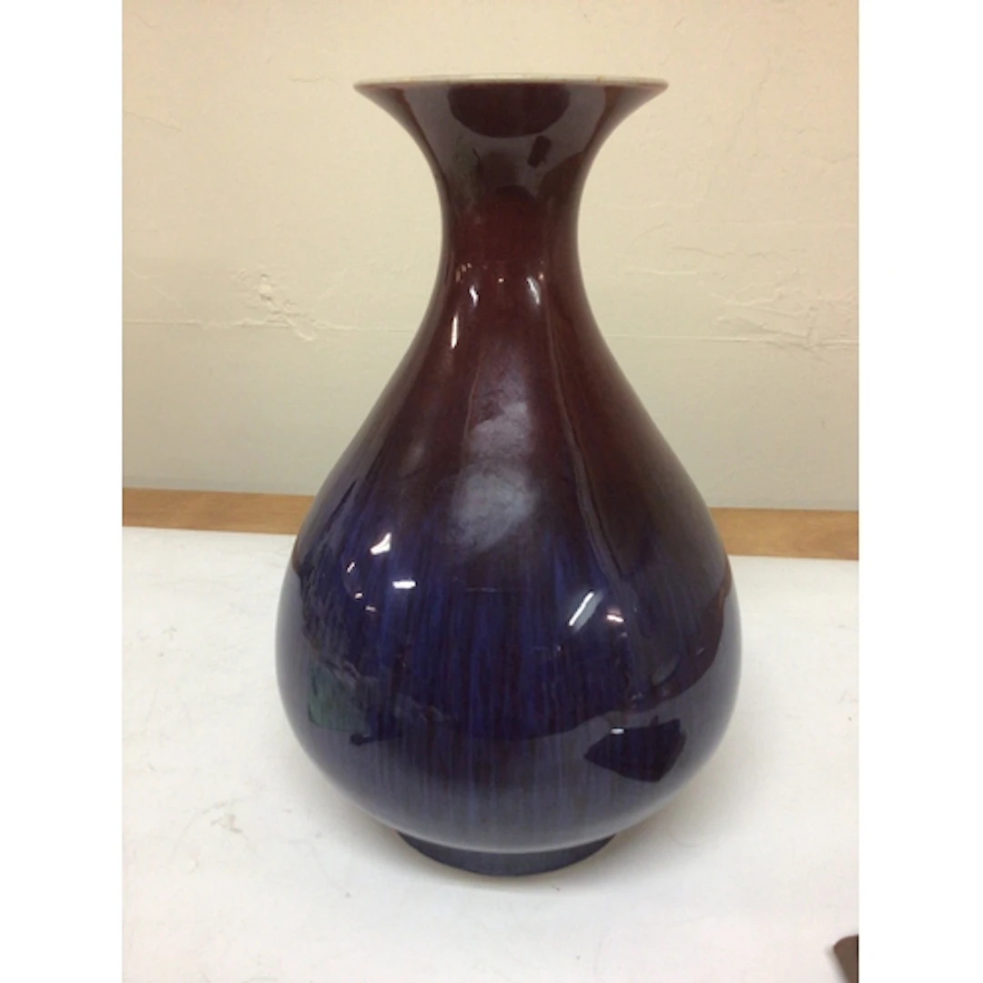 A Chinese Sang de Boeuf Vase of bulbous shape with a two ton...